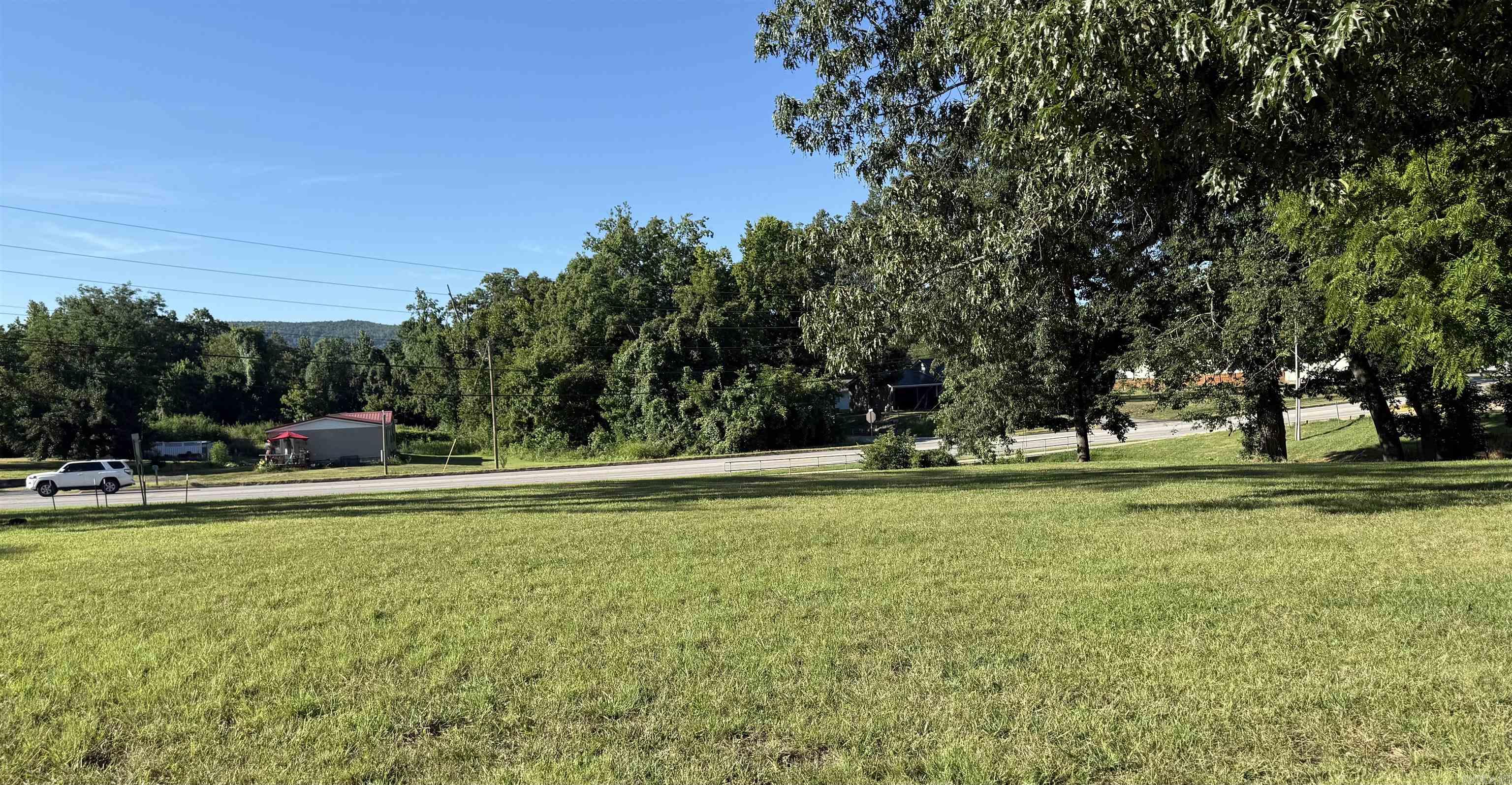 Prime Lot on Highway – Endless Potential! Outstanding opportunity to own a versatile in-town lot located directly on a busy highway with excellent visibility and easy access. This property features a level, open space with highway frontage and ample room for development. A concrete pad is already in place, ideal for future vending, retail, or food service use. Ice machine currently on-site does not convey. Perfect for a small business venture, investment, or build-to-suit project. Utilities available. High traffic count and nearby businesses make this a strategic location for growth. Don’t miss your chance to bring your vision to this highly visible commercial lot!