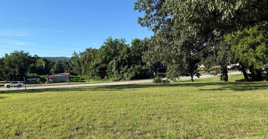 Prime  Lot on Highway – Endless Potential!  Outstanding opportunity to own a versatile in-town lot located directly on a busy highway with excellent visibility and easy access. This property features a level, open space with highway frontage and ample room for development. A concrete pad is already in place, ideal for future vending, retail, or food service use. Ice machine currently on-site does not convey.  Perfect for a small business venture, investment, or build-to-suit project. Utilities available. High traffic count and nearby businesses make this a strategic location for growth.  Don’t miss your chance to bring your vision to this highly visible commercial lot!
