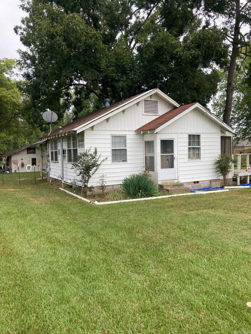 Sold as is where is. All value is placed on the land. House is livable to the right person but needs some repairs. There is a sewer manhole at the road approximately 110ft from the SW corner of property. Property is currently zoned R-1 for single family only. House is one bedroom, one bath with a large laundry room that has windows and a closet. Could be remodeled to be a two bedroom. This will have to be a cash purchase or done with an in bank loan that won't require repairs on home or an appraisal on home. Selling for the land only. No seller property disclosure provided as seller has had home rented and doesn't know condition.