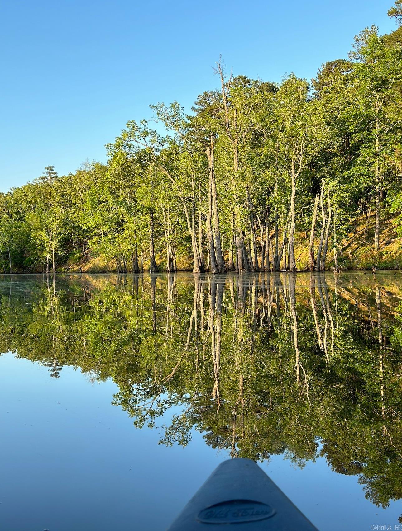 Premier Water Lot ā Lot 4 Devoe Bend, Maumelle, AR Discover one of the most desirable homesites in the serene, gated Devoe Bend Subdivision. Lot 4 is a premier .34-acre water lot that backs directly onto White Oak Bayou, offering breathtaking views and daily visits from wildlife such as deer, herons, and moreāright outside your back door. Tucked away in nature, this property provides that peaceful āliving in the countryā feeling while being just minutes from Maumelleās main shopping, dining, and business districtāoffering the perfect balance of tranquility and convenience. Neighborhood amenities include: ⢠Private kayak launch into White Oak Bayou for effortless fishing or floating ⢠Scenic nature trails looping throughout the community ⢠Designated campsite nearby for relaxed weekend adventures ⢠Ample preserved green space for added peace and natural charm Whether you envision a modern retreat or a cozy forever home, Lot 4 is your blank canvas in a community designed to celebrate the outdoors. This is more than a lot - it's a front-row seat to the quiet beauty of White Oak Bayou with the convenience of the city just around the bend. Schedule your showing today!