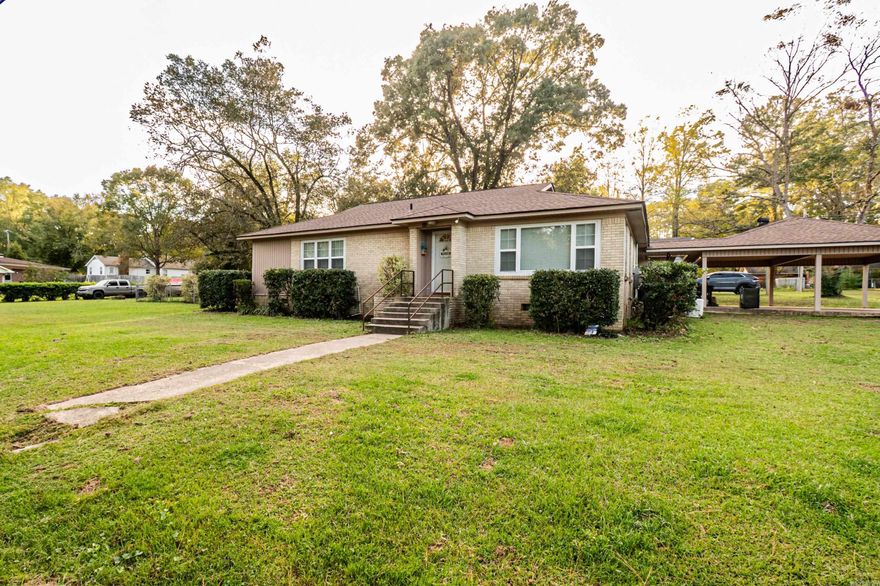 This 3-bedroom, 2-bath property offers space and versatility on two lots, providing plenty of room to add a shop or additional parking. The home features beautiful original hardwood floors, a warm and inviting kitchen, and a large bonus room ideal for extra living space, an office, or a game room. A smaller fenced yard to the side is perfect for pets or a play area. Additional highlights include walk-in closets, large windows that fill the home with natural light, a double carport, and a generator for added convenience. Situated on a corner lot, this property offers both function and charm.