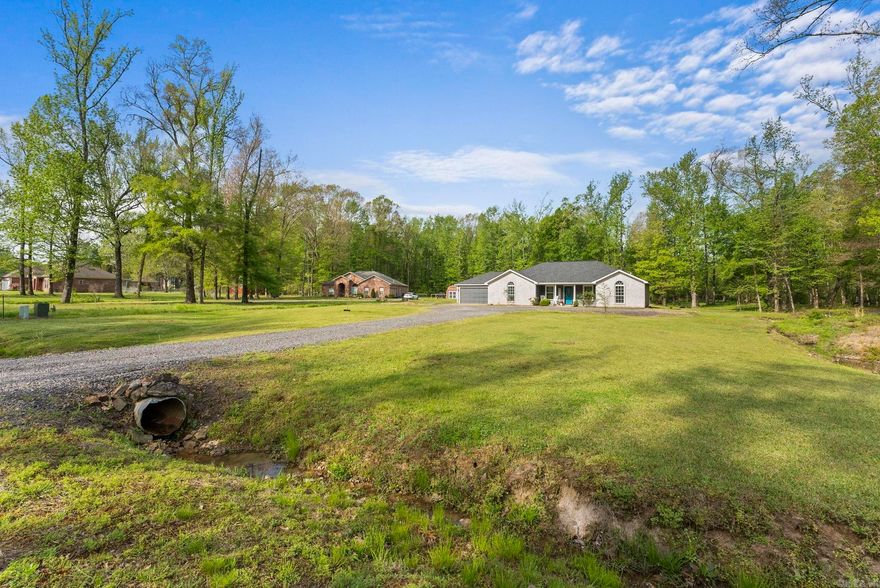 Move In Ready!! Welcome to your private oasis at 192 Williamsburg Cove, nestled on a sprawling 3-acre lot with a meandering creek and a serene, park-like setting. Located in a highly coveted neighborhood with clean sightlines from underground utilities, this property perfectly balances natural tranquility with everyday convenience. It sits just minutes from the interstate and the Little Rock Air Force Base, all within the highly regarded Cabot School District. The home was completely remodeled in late 2024 and boasts premium finishes, including stunning granite countertops and modern LED lighting throughout. Car enthusiasts and hobbyists will especially love the rare luxury of a fully heated and cooled two-car garage. With a brand-new roof, a new water heater, and impeccable modern upgrades from top to bottom, this move-in-ready gem offers total peace of mind in an unbeatable location.