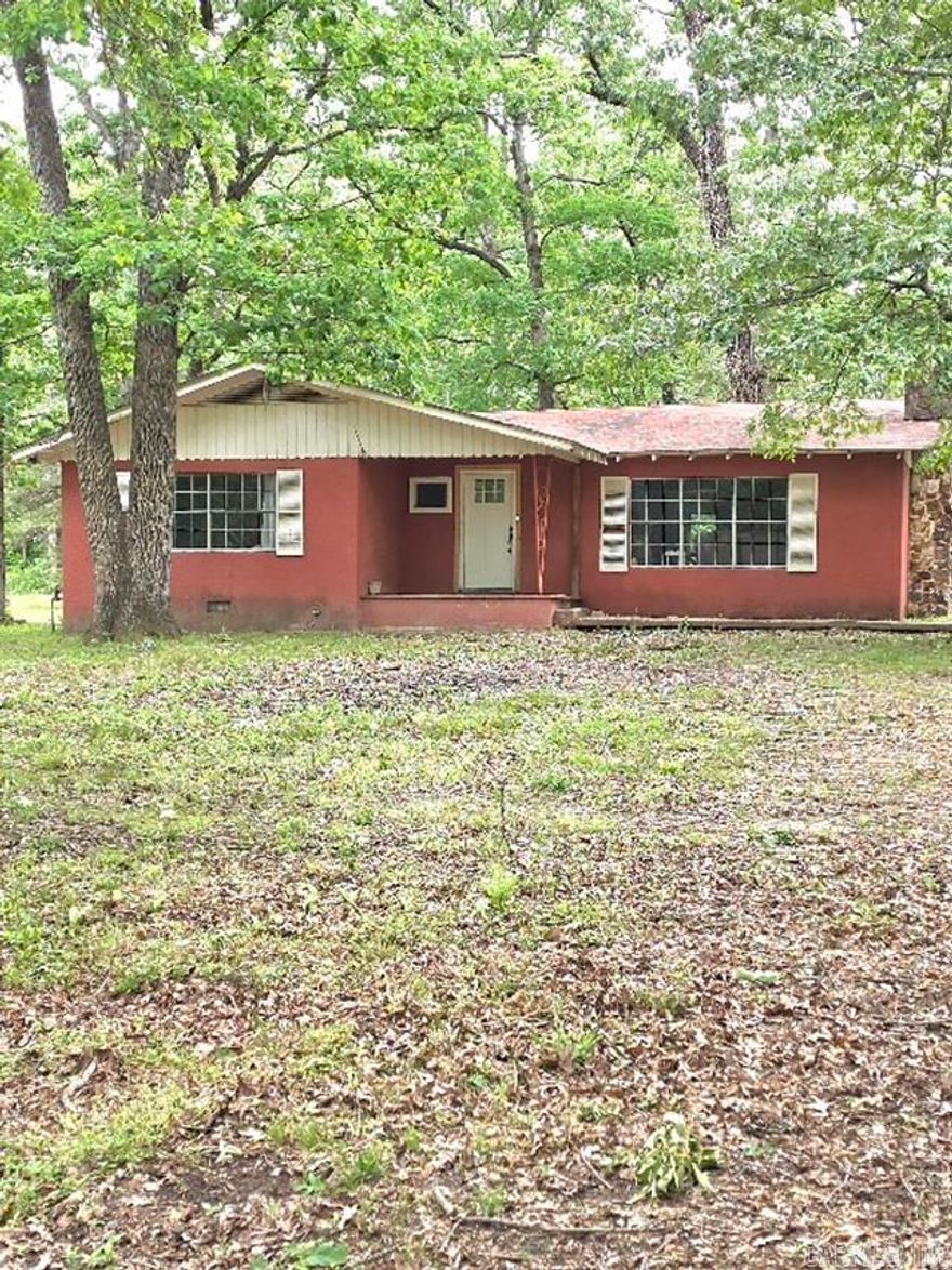 Charming 2-bedroom, 1-bath home situated on 8.25 beautiful acres offering a mix of open space and wooded privacy. This property features a peaceful setting with  fruit trees and plenty of room to enjoy nature or expand, and is located close to the Cossatot River State Park. The home includes a new refrigerator and stove, along with a 2-year-old HVAC system for added comfort and efficiency. Washer, dryer, and freezer will convey with the sale, providing extra value and convenience. While the home could use some updates, it presents a great opportunity for buyers looking to add their personal touch or invest in acreage with potential. Ideal for those seeking a quiet rural lifestyle, hobby farm, or weekend retreat. located close to Cossatot River State Park. Don’t miss the chance to own this versatile property with plenty of possibilities!