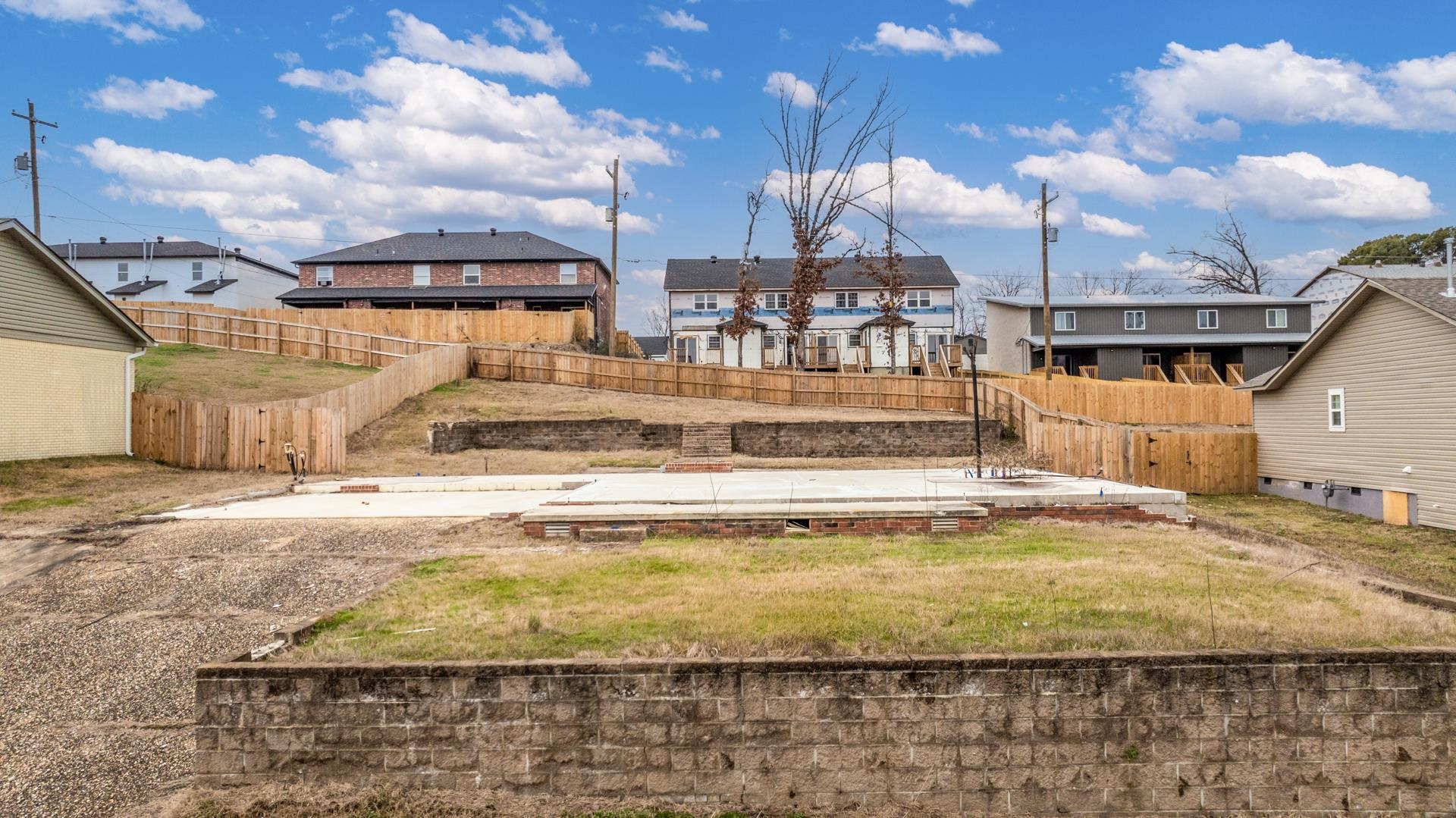 This lot sits in the well established Sanford East subdivision of Little Rock. The lot already has a slab on it that has been plumbed and is ready to be framed. The back yard has a retaining wall that has been installed.