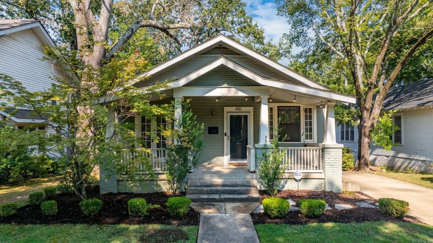 The Hillcrest Bungalow you’ve been waiting for! Nestled in one of the most desirable areas—just blocks from restaurants, shops, and grocery—this timeless Craftsman has been lovingly preserved, blending historic charm with thoughtful updates for modern living. A large, covered, and gated front porch welcomes you into the living room, where original hardwood floors, a site-built fireplace, and updated fixtures set the tone. French doors open to a versatile bonus room, perfect as a third bedroom, office, or creative space. The completely remodeled kitchen features custom cabinetry, quartzite countertops, a hands-free faucet, dry bar, breakfast nook, and dual pantries. The primary suite flows into a stunning spa-like bath with vaulted ceilings, a walk-in shower, double vanity, and expansive walk-in closet. Attention to detail continues throughout, from the stylish guest bath to the serene backyard retreat. A spacious deck offers both open-air and covered areas, with a private hot tub nestled among the old growth trees. Large bonus space in walk-out basement provides great storage/workshop, or could be finished out and used as additional living space.