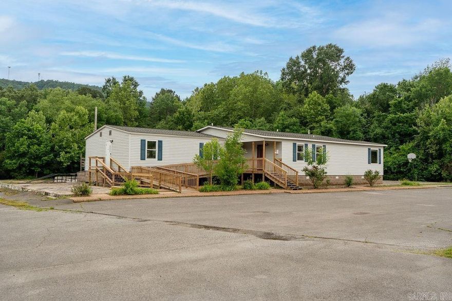 High-visibility commercial opportunity in Heber Springs, Arkansas, located at 817 E. Hwy 110 (Wilburn Rd), just 1 minute from the center of town. This versatile 3.3-acre property features approximately 2,400 square feet of professional office space with an impressive 425 feet of highway frontage for maximum exposure. The building offers a welcoming main entry/foyer, five private offices (two smaller and three larger offices that could also serve as conference rooms), three restrooms, a spacious kitchen, and washer/dryer hookups. Nearly an acre of paved parking in both the front and rear provides ample space for clients, employees, large equipment, or business vehicles, with additional room for future expansion. The flexible layout makes this property ideal for a wide range of businesses, including professional offices, medical, educational, daycare, or service-based operations. Surrounded by attractive park-like grounds, this well-maintained property also features a new roof installed in 2024 and HVAC updated in 2020.