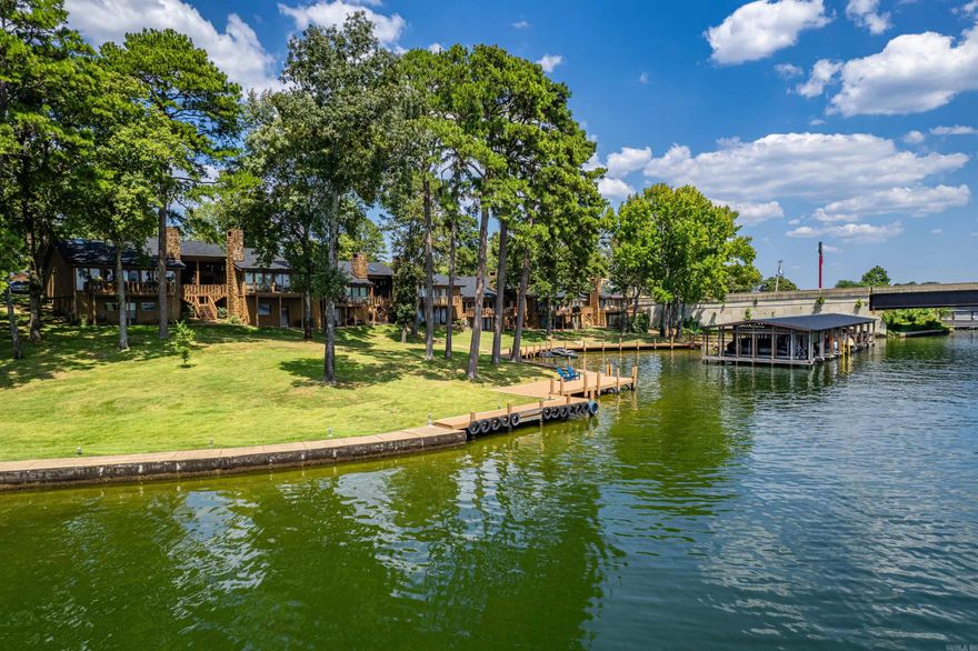Welcome to Hamilton Pointe, a beautifully appointed lakefront condo located in the heart of Hot Springs, AR. This Lake Hamilton property offers an unparalleled living experience, featuring stunning views of the main Lake channe, making every day feel like a vacation. Step inside and be captivated by the spacious, open-concept living area that seamlessly blends comfort and elegance. Large windows frame the picturesque lake views, allowing natural light to flood the space and create a warm, inviting atmosphere. The living room opens onto a private balcony, where you can enjoy your morning coffee or unwind in the evenings. The condo boasts a well-equipped kitchen with ample cabinetry and modern appliances, making meal preparation a pleasure. The master suite offers a peaceful retreat, complete with an en-suite bathroom and more of those incredible lake views. Beyond the condo itself, residents have access to an array of amenities. Take advantage of the sparkling pool, perfect for cooling off on hot summer days, or head down to the private boat slip for a day on the water. Whether you're an avid boater or simply enjoy the beauty of the lake, this property offers the ideal setting.