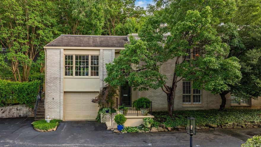 Nestled in the charming neighborhood of Hillcrest, this beautiful townhome feels like a luxurious treehouse retreat. Elegantly appointed and move-in ready. With two bedrooms and two baths, it’s been thoughtfully updated to include hardwood floors throughout with carpet in the bedrooms, plantation shutters, crown molding & gas fireplace. The outside back sitting area offers a private retreat. The kitchen features stainless appliances, granite countertops, glass tile backsplash & gas oven. The large windows in the living area look out onto the trees in Allsopp Park. A second living area could be used as an office or TV room. The primary bedroom includes a walk-in closet and en-suite bath. Recent updates include tankless water heater, new dishwasher, custom-built mantel, fixtures, lighting, ceiling fans, fresh paint throughout. Garage with extra storage space. POA fees cover gas, water, sewer, trash, recycling, exterior maintenance & insurance, termite contract, quarterly pest service, landscaping, access to the pool, clubhouse & exercise room.