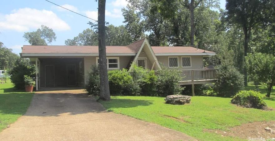 House located close to Lake Sequoyah. Offers 2 bedrooms, full bath with hardwood flooring. Situated on a big corner lot. Also has open living room with vaulted ceiling, central heat & air, nice front deck, all located within walking distance to Lake Sequoyah. What A Price!!!