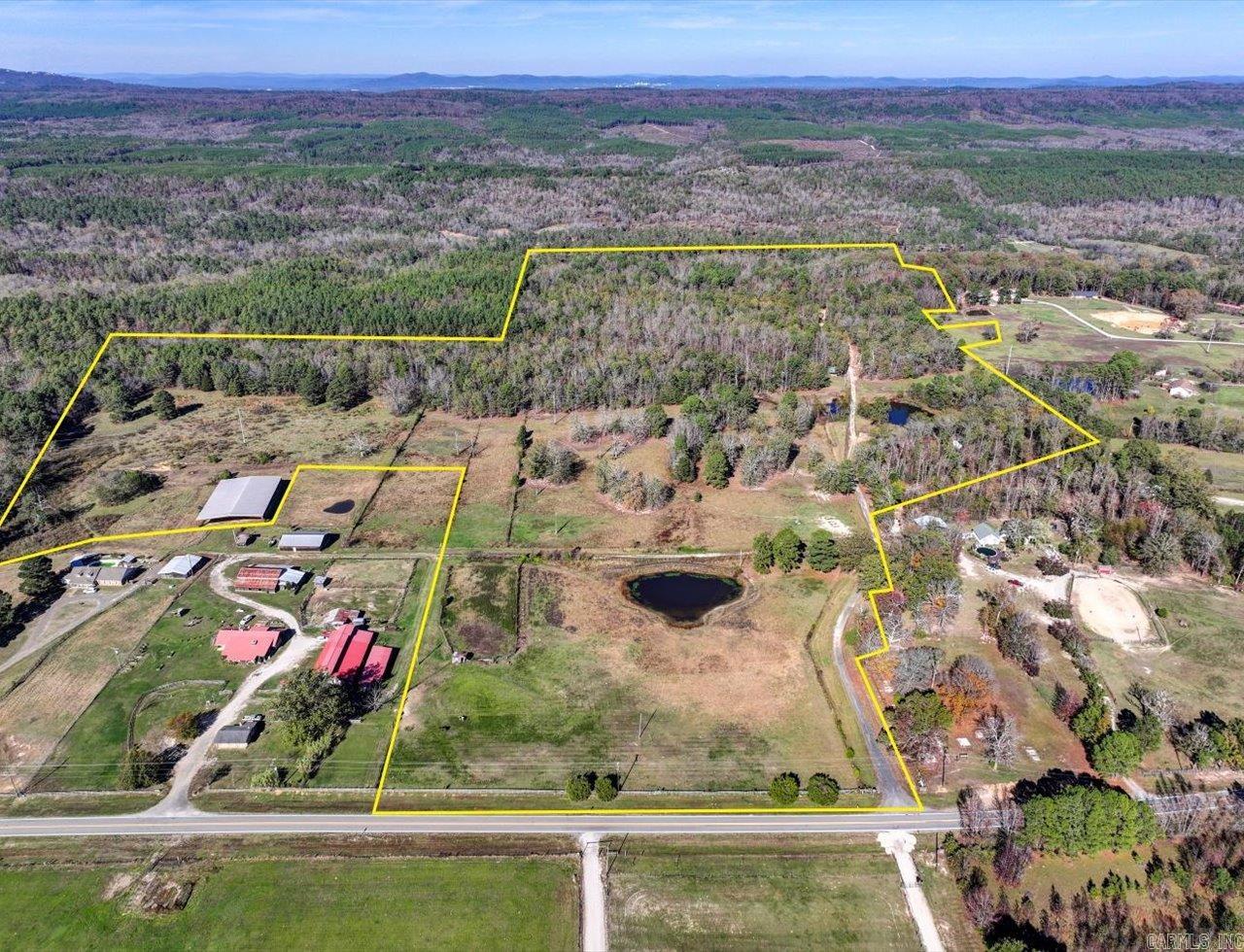 Formally known as the bar 50 RV park and horse camp, this property consist of approximately 86.77 acres featuring 52 RV hook ups, horse pens, public restrooms, shower house, ponds, and large covered riding area/event center. There is also a double wide manufactured home that could be used as a personal residence or managers quarters.