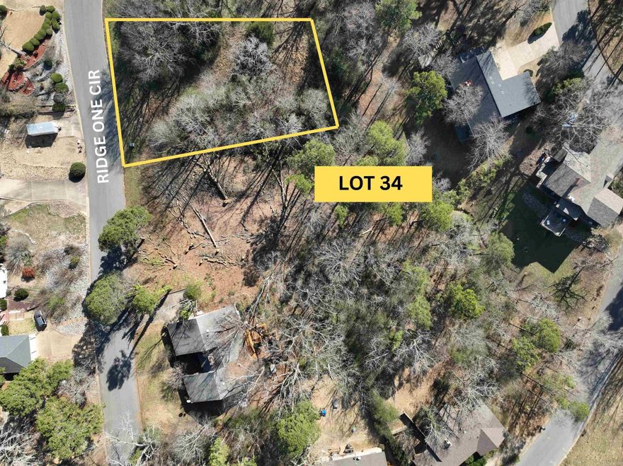 Beautiful lots in existing subdivision. Near new bypass.  All utilities available.  Located off of scenic Hwy 7.  5 minutes to Historic Downtown Hot Springs.  Less than 7 miles from Oaklawn Racing & Gaming. Near HSV and Bike Trails. Subdivision in old Belvedere Golf Community is surrounded by over 500 acres of Dept of Agriculture acreage. Steep and wooded lot, vista views.