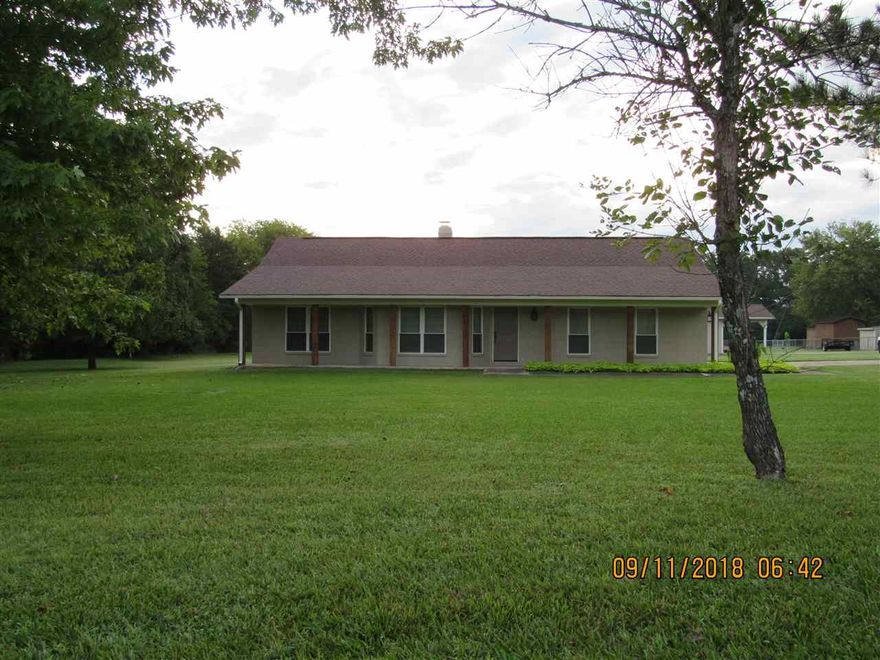 Well maintained split bedroom plan, recently updated with new paint, new vinyl plank flooring, new granite countertops in kitchen and baths, new cabinets and tile backsplash, new insulated windows & doors with blinds, new Whirpool stainless appliances, separate dining room, covered porch off kitchen, new gas log fireplace, high efficiency central HVAC, 2 car garage with storage & floored attic space, private location close to Lake Beaverfork, beautiful 3 acre lot with 2.5 of it maintained by the owner!