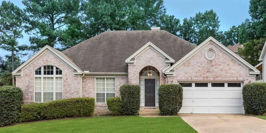 Beautifully appointed home with open floor plan: from the entrance to tray ceilings in living area which boasts a wood burning fireplace and built in bookshelves. Eat-in kitchen has tile granite counters, refrigerator conveys.  Large dining room off kitchen. Huge master suite for your king size bedroom, sitting area, and bath ensemble. Second bedroom has built in desk and bookshelves and also boasts a  vaulted ceiling. Beautiful mill work. Lovely neighborhood and flat backyard in Don Roberts School Zone.