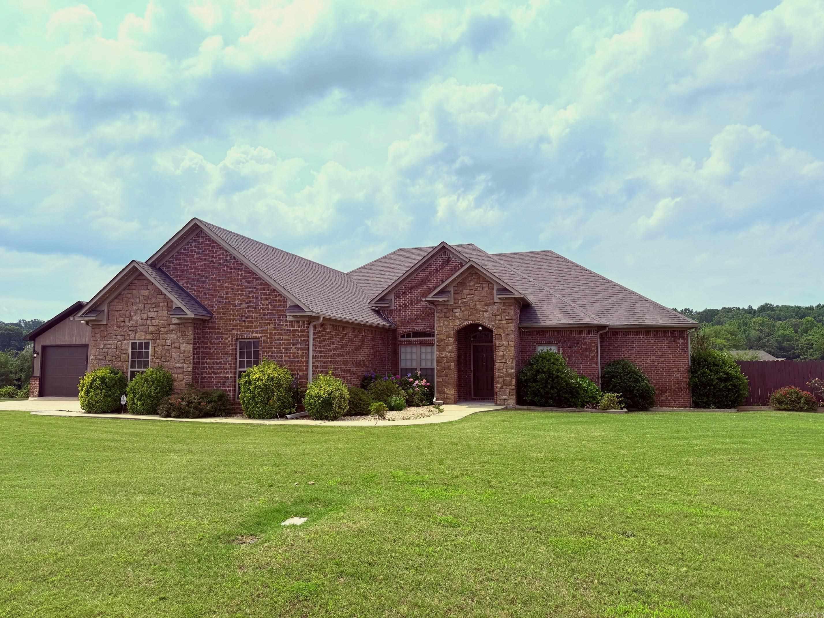 This beautiful property has everything you’ve been looking for — including a dream 20x20 shop, perfect for your hobbies, boat, or ATV! Save money every month with brand-new solar panels that eliminate your electric bill.  Inside, you’ll find 4 spacious bedrooms and 2 full baths, plus recent updates throughout: a new roof (2023), new HVAC system (2021), and new carpet (2023). The cozy living room features a custom stone LED electric fireplace, granite countertops throughout, stainless steel appliances, and beautiful stained concrete floors. Step outside to your large, fenced lot — just under an acre! The covered patio is perfect for backyard barbecues, family gatherings, or simply relaxing at the end of the day. This home truly has it all — space, comfort, and style in one great package!