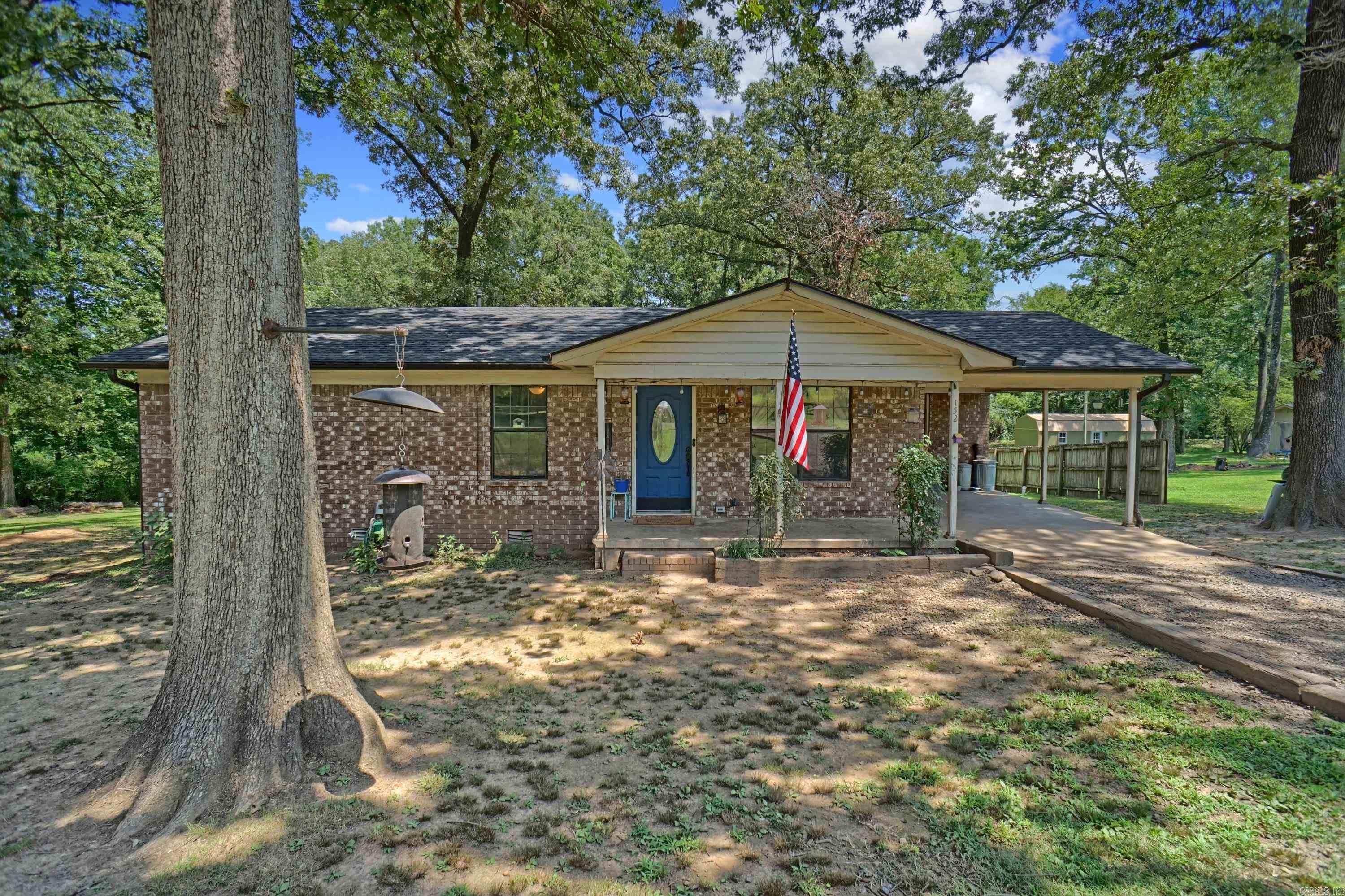 Welcome to 152 Holts Road—a charming slice of country comfort nestled between Pottsville and Russellville. This cozy 1,187 SF brick home sits on 1.2 peaceful acres (MOL) and features three welcoming bedrooms and one full bath, making it a perfect place to settle in and make your own. Recent updates include a new roof and gutters (2024) and a new HVAC system (2020), giving you comfort and peace of mind from the start. You'll love the attached one-car carport for everyday convenience, and the bonus outbuilding out back is perfect for storage, hobbies, or weekend tinkering. Located in the Pottsville School District and just minutes from both towns, this home offers the quiet of the country with the convenience of being close to schools and amenities. Don’t miss the chance to enjoy simple living in a truly special location.