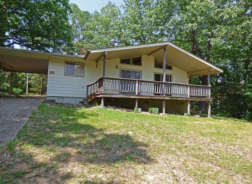 Needs a Bit of Work - This 3 bedroom, 1 full bath and 1 half bath home needs your TLC. Give this paneling a coat of paint to lighten things up, pull the carpet to reveal the hardwood flooring and update the kitchen and baths. The exterior is in good shape with a nice roof, siding and a covered front deck. There's lots of parking behind the home as well as a detached storage building. All this sits on 2 lots for space and privacy. Value Priced!