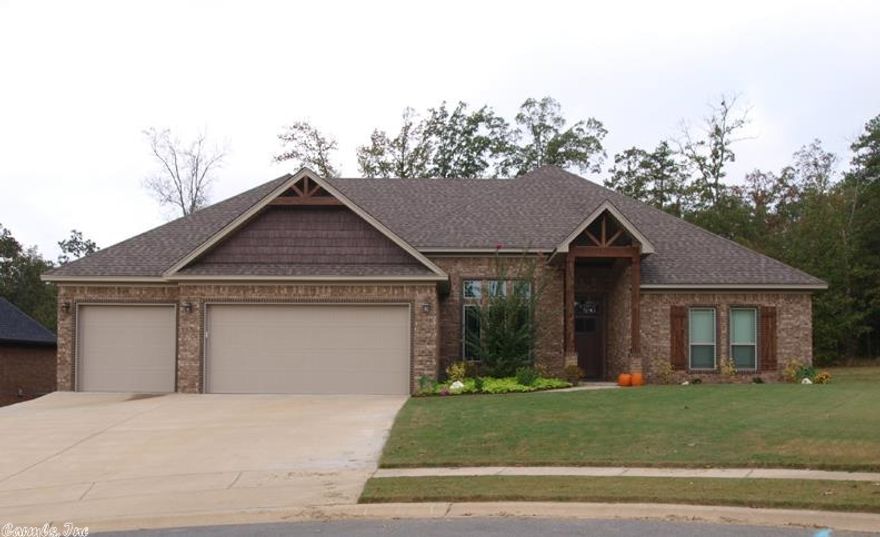 Fabulous one level home with 12' ceilings in the entry, formal dining, w/hardwood & 18" ceramic tile flooring, granite countertops, gaslog fireplace, stone & brick exterior, located in Bryant School District. 15 Seer HVAC, laundry shoot, 3 car garage,