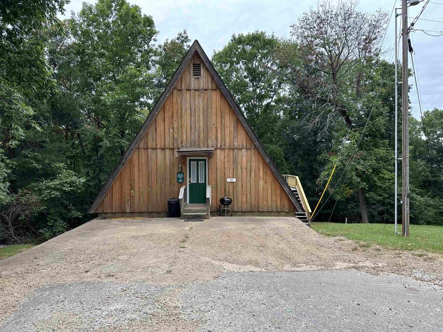 A-Frame Cabin  - This cabin has been remodeled inside with a living room, wood & vinyl plank flooring, kitchen with stainless steel appliances, nice remodeled bathroom, sleeping loft that can accommodate several people. A back deck for grilling and relaxing. This A-Frame cabin is ready to move into! It has been an income producing nightly rental if you're interested in an investment.