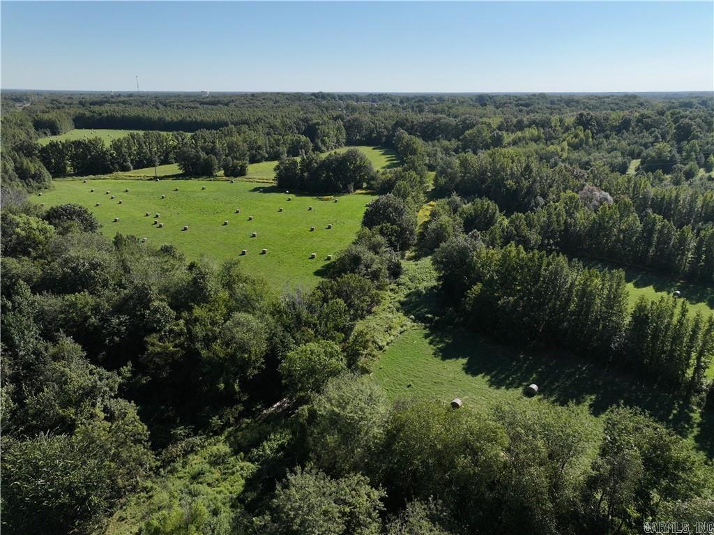 Newly Surveyed 1/9/25!! Discover the perfect blend of seclusion & convenience with this stunning 270.78+/- acre property, located in the sought-after Cabot School District. This recreational haven offers a variety of fenced landscapes, including established hay fields, hardwood forests, & two ponds (one spring-fed). Bordering Austin City Park, residents have easy access to several amenities & a convenience to town while maintaining privacy. The property is ideal for outdoor enthusiasts with wildlife such as deer, turkey, & other small game. Electricity is available throughout, with city water accessible at the street, adding modern convenience to this private retreat. Whether you're looking for a secluded getaway or considering development opportunities, this property offers endless potential. Property is perfect for investors & developers looking to add to the ever-growing area. Will consider subdivide. Don't miss out on this rare opportunity to own a versatile & beautiful piece of land in a prime location.