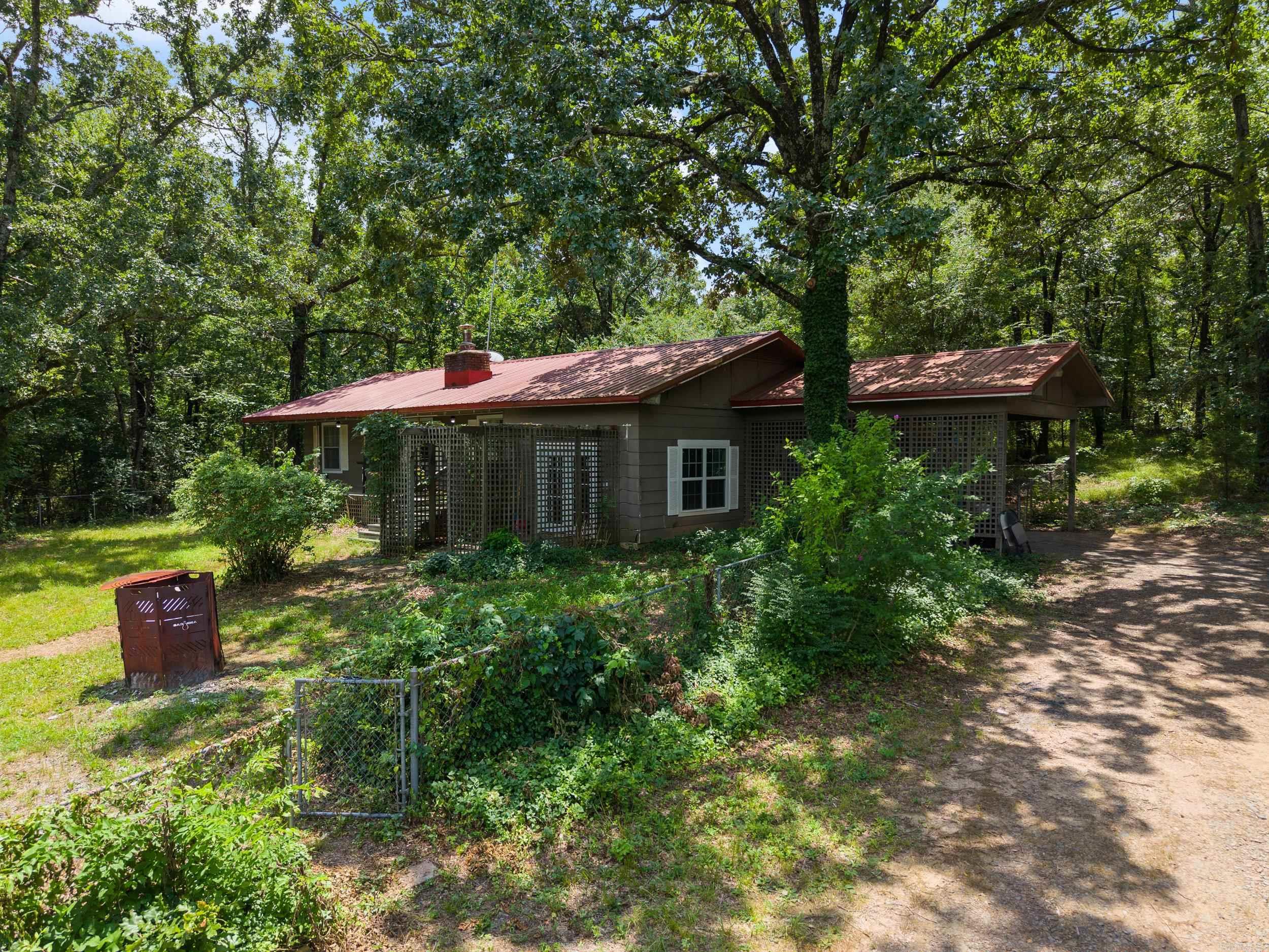 Three bedrooms, two baths with updates. This prime acreage is approximately one fourth mile to the Arkansas River boat ramp. Two parcels make up the 8 acres. Plenty of room for a garden, additional properties, a pool, unlimited possibilities. Just minutes from West Conway. Don't miss out on this rare opportunity for acreage and a cute home! Call CSS for all showings, 501-244-0333 one-hour minimum notice required.