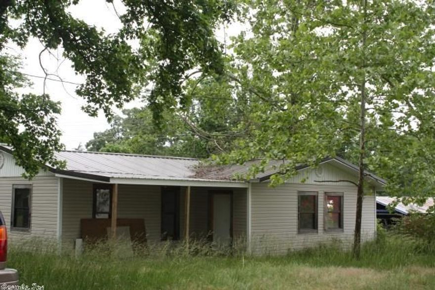 Completely remodeling but had to quit due to losing her husband.  They put vinyl siding on the outside and a metal roof.  They installed new plywood floor.  The walls are sheet rocked, textured and painted.  All that lacks is the trim and doors.  The bath room fixtures are there.  The kitchen is the only room that has no fixtures.  There is a deck in the back and the front.  Finish up and save money.