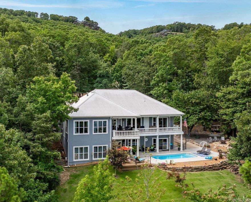 New to the rental market with over $60k of bookings for 2025 & into 2026, you will find this exquisite lakefront property offers the perfect blend of elegance & comfort & gorgeous lake views. Boasting 6 generously sized bedrooms & 3 full baths, plus 3 half baths, this residence ensures ample space for both family & many guests. The chef’s kitchen is equipped with top-of-the-line appliances, sleek countertops, & custom cabinetry. The home features high-end finishes throughout, including luxurious flooring, stylish fixtures, & expansive windows that capture stunning lake views. Enjoy outdoor living at its finest with an in-ground salt water pool, & multiple entertaining areas with a fire pit perfect for hosting gatherings or relaxing in style.The property includes a convenient circle drive for easy access & ample parking. More great features include a whole home generator & Sonos sound system inside/outside. Whether you're seeking a peaceful retreat or an entertainer's paradise, this lakefront home on Greers Ferry Lake offers the ultimate in luxury living. Don’t miss the opportunity to make this stunning property your own. Schedule your private showing today!  Remarks