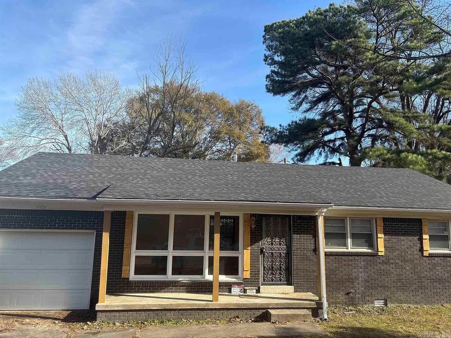 Beautifully updated, 3-bedroom, 2-bath brick home featuring an open floor plan and modern finishes throughout. Recent upgrades include a new roof, new water heater, and updated plumbing and electrical. Both bathrooms have been fully renovated with tiled showers, new vanities, faucets, and commodes. Hardwood floors run throughout the home, with new vinyl flooring in the kitchen and dining area. The kitchen has been completely updated with new countertops, custom cabinetry, and a spacious island perfect for entertaining. The dining area offers a great view of the backyard. Additional updates include new lighting throughout, fresh interior paint, and all new interior and exterior doors. A one-car garage with additional storage completes this move-in-ready home.