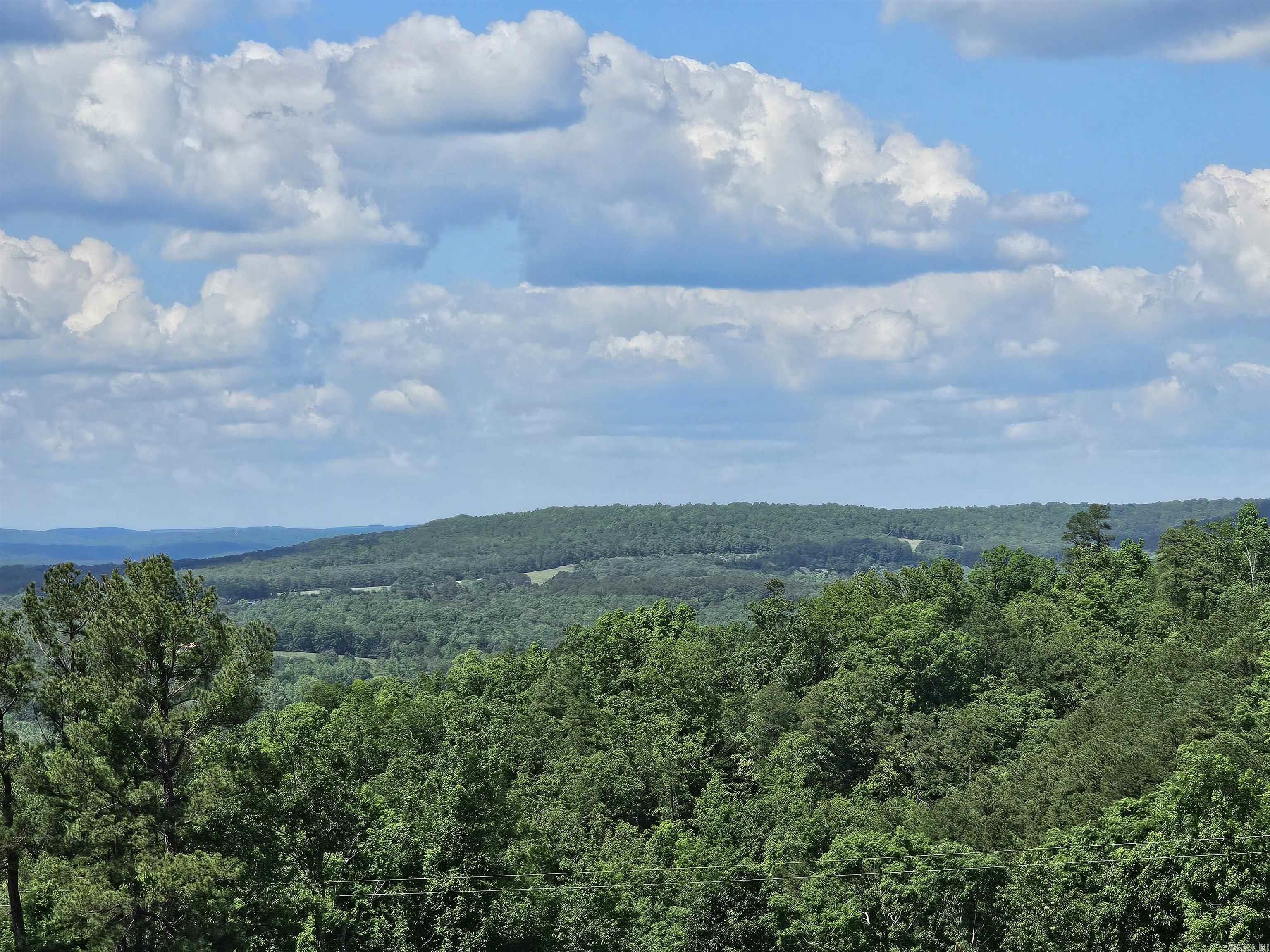 Discover this beautiful 5.84 acres m/l of unrestricted land with breathtaking views of the Ozark Mountains. This property offers cleared and level building sites, making it the perfect place to build your dream home. Utilities are conveniently located at the road, and you're just a 10-minute drive from Walmart and the beautiful Greers Ferry Lake. Enjoy peaceful country living without sacrificing the convenience of city amenities. Donāt miss out on this incredible opportunity!
