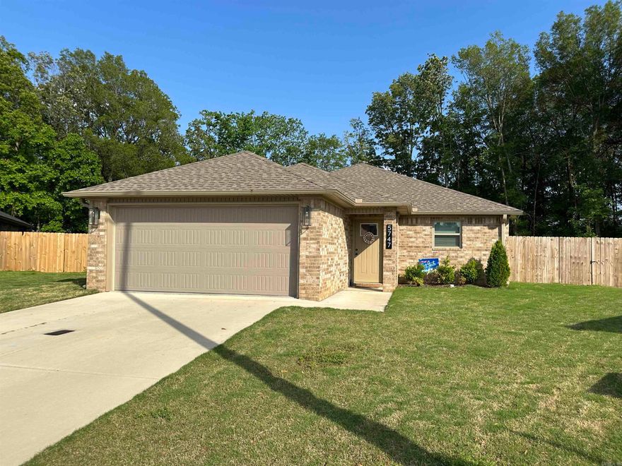 Don't miss this beautiful and spacious 3-bedroom, 2-bathroom brick home with an open floorplan! Only 2 years old, this home offers numerous upgrades, including one of the largest lots in the neighborhood with a wood privacy fence, a screened-in back porch, custom blinds, and more. The refrigerator, washer, and dryer are included, making this move-in ready property even more convenient. Come see all the extras this stunning home has to offer!