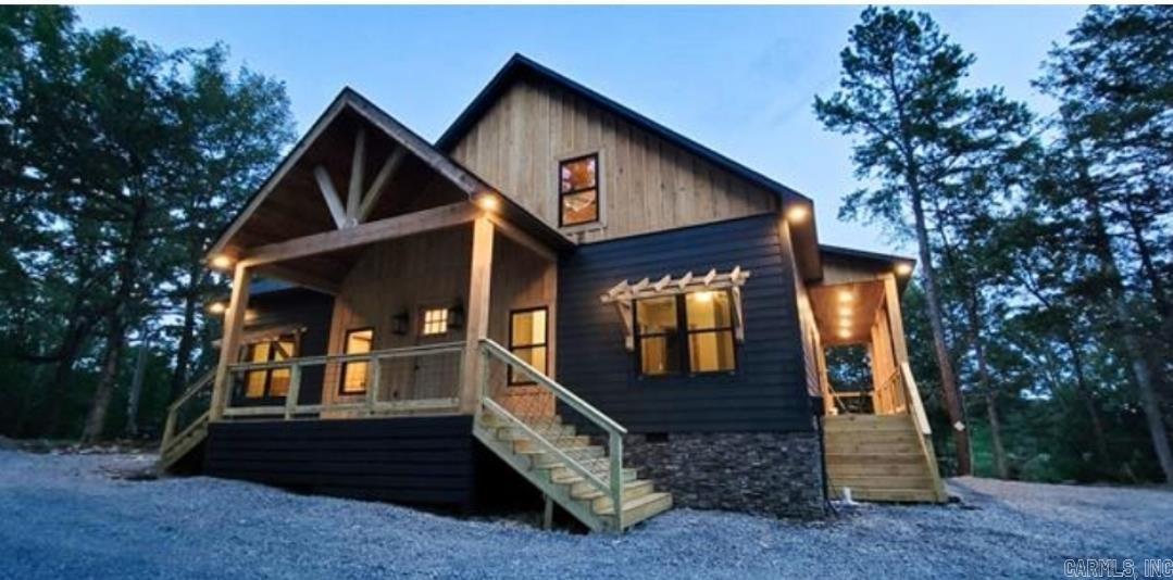 Welcome to a lakefront retreat like no other, nestled on a beautiful peninsula with breathtaking views of the iconic Greers Ferry Lake. This home offers four bedrooms and four baths, Multiple ways lead you down to the pristine waters of Greers Ferry Lake, providing easy access for swimming and water activities. You'll celebrate in the outdoors on the expansive deck, where you can soak up the sun, savor a barbecue, or simply unwind. This newly constructed home offers a unique opportunity to own a highly successful nightly rental property (income details available with a signed confidentiality agreement). The property is being sold fully furnished, making it turnkey for the next lucky owner. Across the street lies the iconic Tannenbaum Golf Course, offering golf enthusiasts a world-class experience just steps from your front door. In the evenings, gather around the outdoor fire pit to share stories and stargaze, creating lasting memories. This remarkable property is more than a home; it's a destination where the road ends and relaxation begins. Embrace the tranquility of lakefront living and make this extraordinary retreat your own.