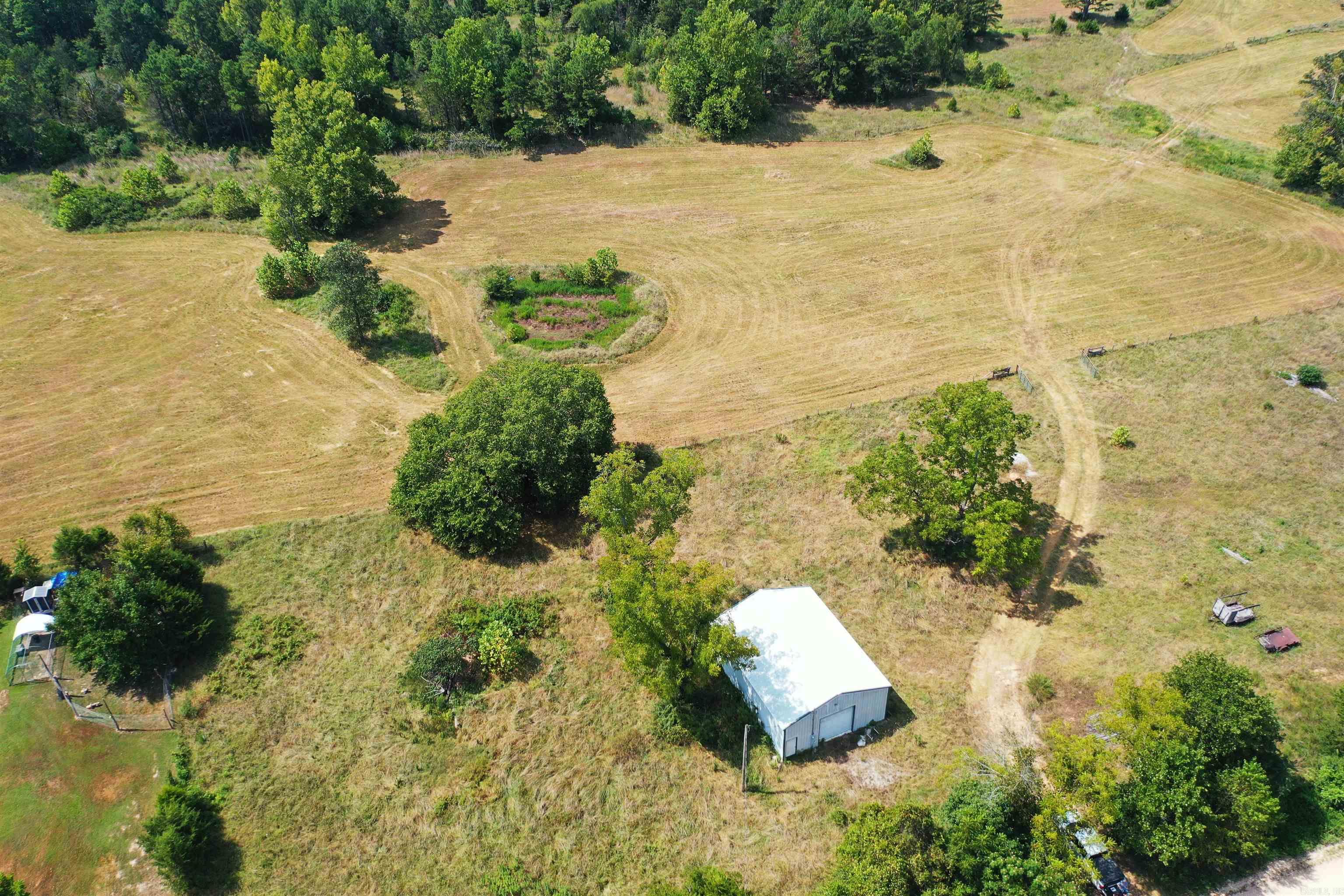 Prime Property. 82 acres M/L of unrestricted pasture and woodland south of Viola, AR. Come see this beautiful property with cleared land to build your dream home, outdoor paradise, cattle farming, investing and hunting. Hay fields which just produced over 70 bales of hay. Timber land for turkey and deer hunting with 2 deer stand blinds included. Completely fenced and cross fenced with metal gates. Water is run to other pastures for livestock with automatic waters. North side of property has a spring.30ā x 40ā shop building with electric and 2 drive through doors. Dependable water sources with well and rural water access is also available. Property is located 3/10 miles from paved road with county road frontage. Less than 11 miles to Norfork Lake and 20 miles to White River.
