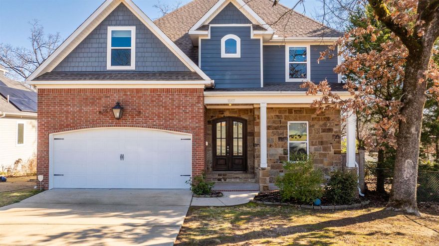 Built in 2016 and located in the Hillcrest neighborhood, this stunning 4-bedroom, 3-bath home offers 3,163 square feet of beautifully designed living space filled with natural light and upscale finishes. The main-level primary suite provides a private retreat with a spacious closet and a well-appointed bath. Open living and dining areas feature hardwood floors and a seamless flow, ideal for both everyday living and entertaining. The kitchen shines with premium appliances, custom cabinetry, a generous island, and a butler’s pantry for added storage and functionality. Upstairs, three additional bedrooms and two full bathrooms offer flexible living options. Enjoy outdoor spaces including a charming front porch and a spacious back deck overlooking the backyard that is perfect for relaxing or hosting. Conveniently located near parks, shops, and dining, this Hillcrest home delivers modern comfort and timeless appeal.