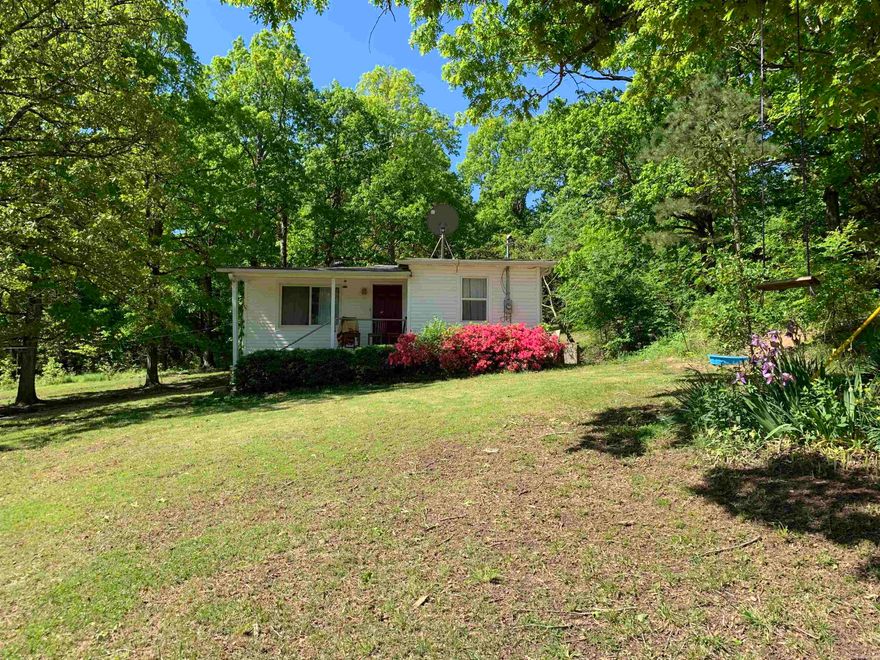 Prime investment opportunity in a great location just 12 minutes from town. This 720 sq ft, 2 bedroom, 1 bath home features a sunroom and sits on a shaded 2 acre lot with a producing apple tree concrete parking pad, and storm shelter. The land is beautiful and there's lots of deer and birds. Major improvements include a new roof and HVAC installed two years ago December 2023, along with a new septic system installed approximately 7 years ago. This home will NOT go FHA or RD. Tenant occupied please do not disturb tenant. Agent owned, photos taken prior to tenant moving in.