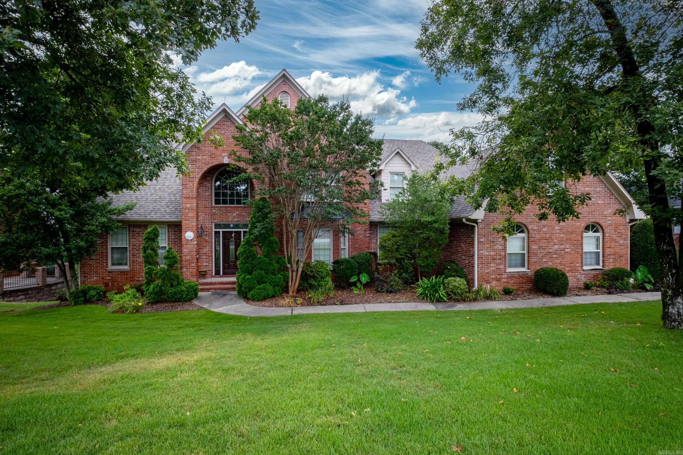 Beautiful family home w/large rooms throughout & overlooks a beautiful forest or panoramic view of Little Rock with some trees removed. Updated kitchen offer granite countertop & warming drawer. Spacious den(22x19), large main bedroom & bath down, large formal dining and four large bedrooms up plus a workout room as well. Screened porch + open deck with a large deck below for children to roam. Decks shaded in the hot afternoon sun. Side-loading 3 car garage with large drive apron for basketball. "Crawl space" has over 12 ft ceiling! Ideal for workshop & storm shelter. Private neighborhood. Nearly level streetIdeal for safe walking/jogging or kids biking w/o traffic concerns.
