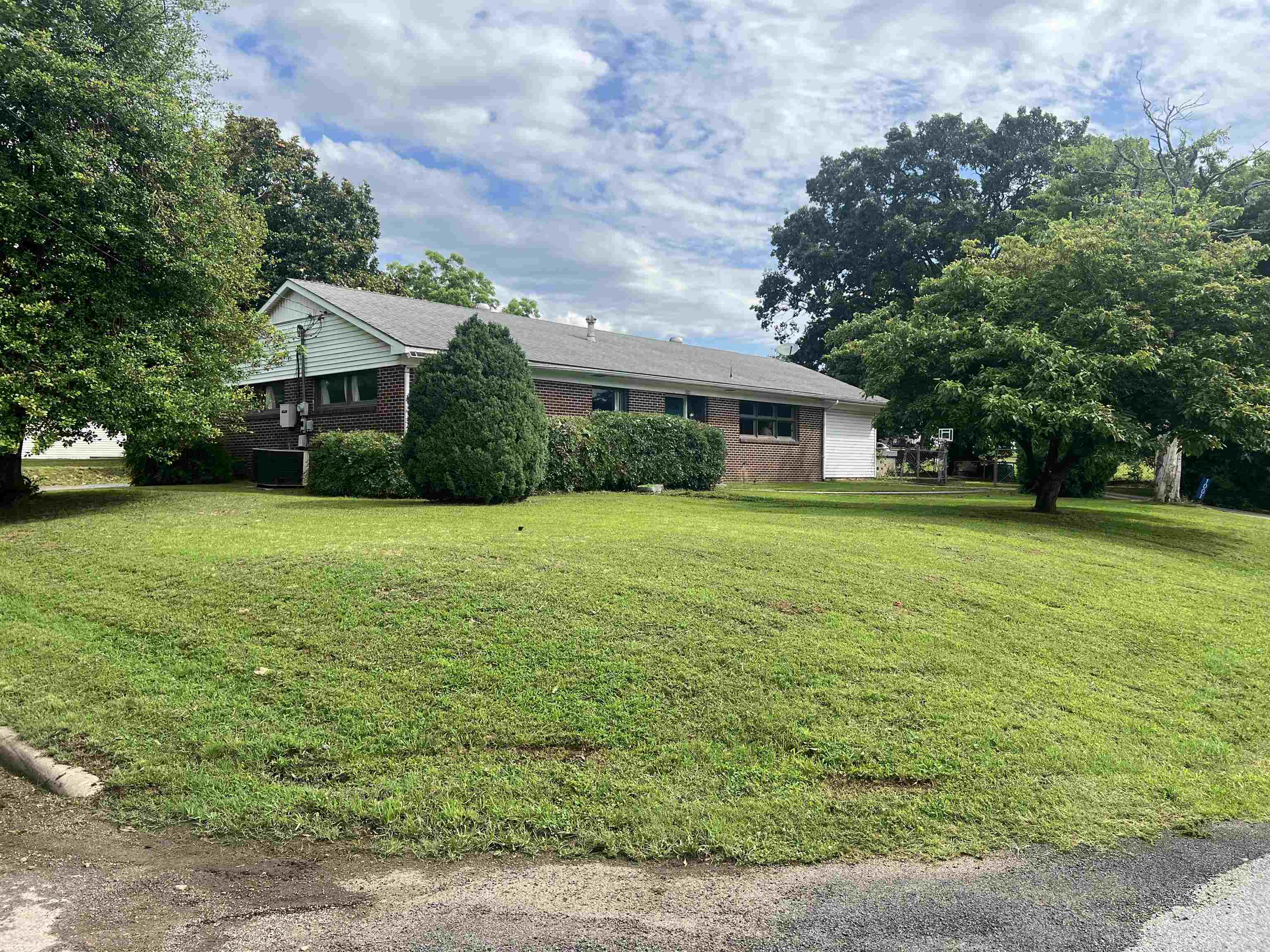 This peaceful brick home is just two blocks from the museum and a short stroll to historic downtown Batesville! This 3 bed, 1.5 bath gem sits on a huge corner lot and is packed with extras. Inside, enjoy an open living and dining area, a massive living room, and a retro-chic kitchen with metal cabinets and a roomy laundry area. Step outside to a huge fenced backyard, oversized patio, and an in-ground storm shelter with electricāperfect for peace of mind and outdoor fun! The 2-car carport has not one, but two storage rooms, plus there's both a paved rear drive and a concrete front walk leading to the front door. This home has the space, location, and charm youāve been waiting for.