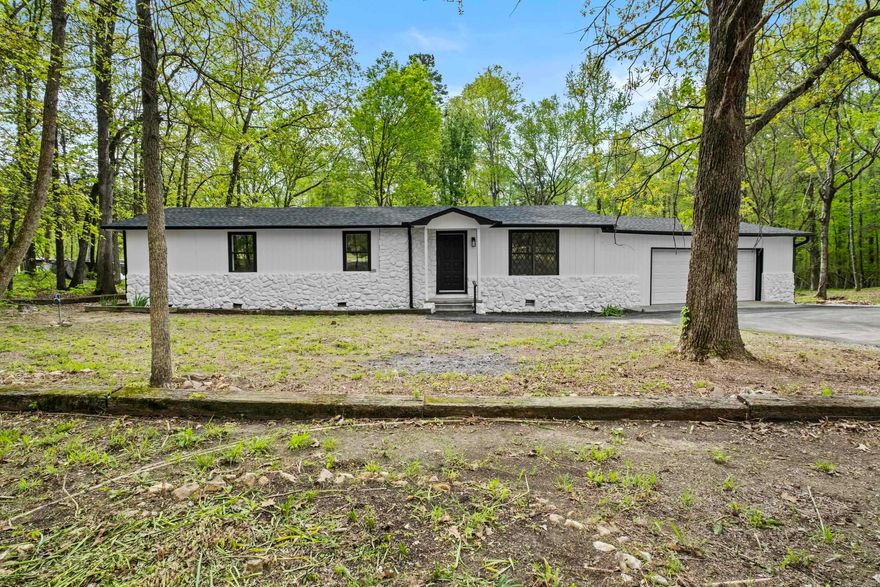 Welcome to 15503 Chicopee Trail, a beautifully transformed 3-bedroom, 2 bath home nestled on 2.9 acres in Little Rock. This property offers the perfect balance of modern comfort and peaceful country living-Just 10 minutes from I-430, Colonel Glenn, and the Outlets of Little Rock. Inside, you'll find a bright open floor plan with a spacious living area, new electric fireplace, formal dining room, and a cozy sunroom-ideal for morning coffee or plant lovers. The brand new kitchen and fully updated bathrooms shine with stylish finishes, and the home features luxury vinyl flooring and two walk-in closets for ample storage. Outdoor enthusiasts will love the space to garden, raise animals, or simply unwind in nature. Watch deer roam the yard or collect fresh eggs from your own chickens. A 12x35 wired and floored shed/workshop adds even more versatility-perfect for hobbies, storage, or a home business. New HVAC, WH, drywall & siding, paint inside and out, new flooring, kitchen cabinets, vanities, light fixtures and hardware, new deck and mailbox. NO SPD! Owner has never lived in the property.