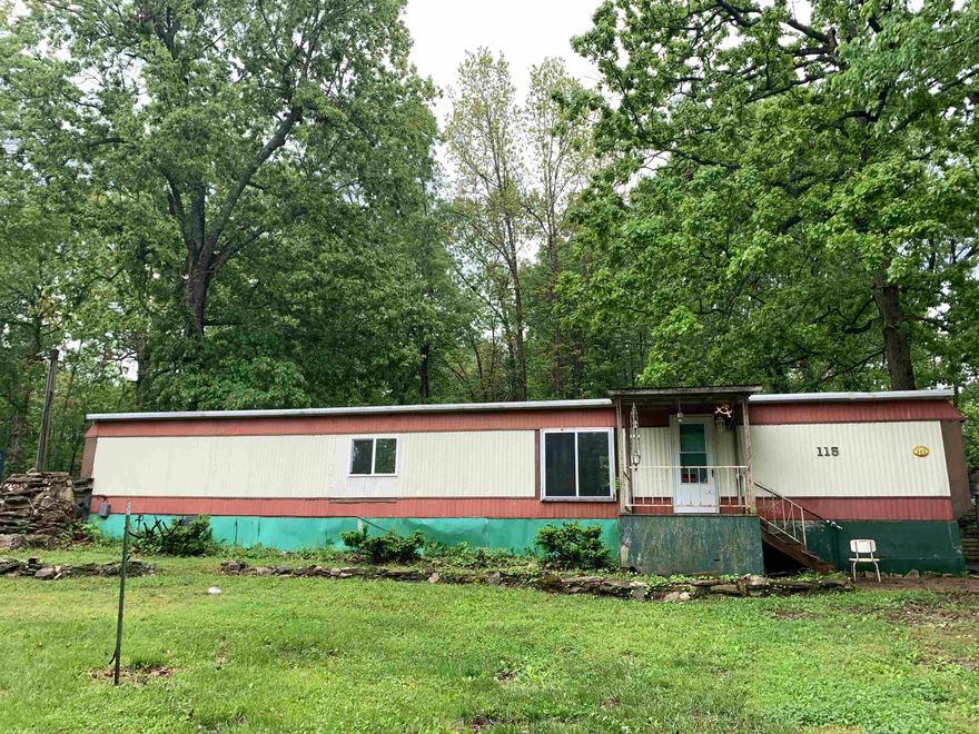 This property sold AS IS, WHERE IS. This 2 bed 2 full bath mobile home includes a bonus room that can be used as a small office or hobby/craft space . The property boasts a large front yard with an eccentric water feature that one can turn into a koi pond or a lovely waterfall. The backyard is partially-fenced with a gate on each side of the home, large shade trees, and enough space for family and friends to gather around a fire pit on those cooler nights. For the man (or woman) of the house, there are 2 sheds for both a workshop and tool storage. This home is in a quiet, and low-traffic neighborhood and is a delightfully short distance from medical facilities, grocery stores, and restaurants.