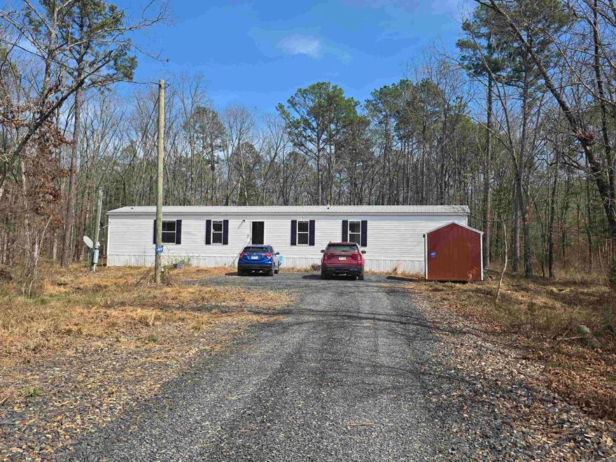 You can't get much closer to the city limits than this and still be in the county!  Almost 5 acres, mostly wooded, with abundant deer population!  Merren Creek nearby. Neat and nearly new 3/2 with separate bedrooms, laundry room located conveniently off the kitchen, along with 2nd bathroom. Great, open floor plan, and room to expand, if necessary.