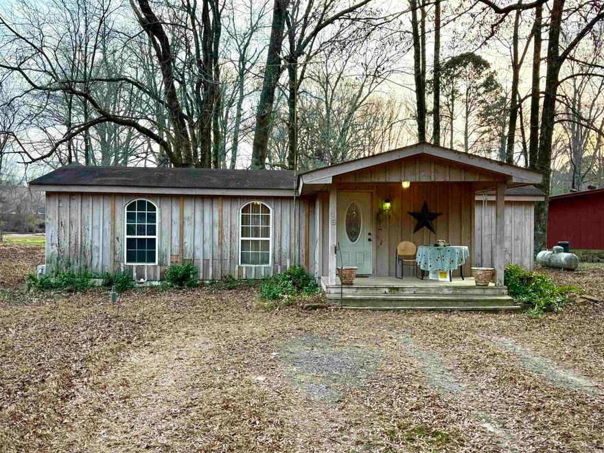 Enjoy peaceful living with this lakefront tiny home in Morrilton, offering a rare combination of affordability, convenience, and scenic views. Designed for efficient living, the home features low utility costs, and the majority of the plumbing has been recently updated, adding value and peace of mind for the next owner. The septic system has also been recently serviced, allowing for a smooth and easy transition at closing.  The property backs directly up to the lake, making it an ideal fishing cabin, weekend retreat, or full-time residence for those who enjoy outdoor living and waterfront views. Whether casting a line, relaxing outdoors, or simply enjoying the setting, this location offers a true lakeside lifestyle.  Conveniently located with quick access to Interstate 40, the property allows for easy travel to both Russellville and Conway, providing flexibility for commuting, recreation, and everyday conveniences.  Whether you're seeking a low-maintenance lifestyle, a peaceful getaway, or a smart investment opportunity, this strategically located lakefront property delivers comfort, accessibility, and long-term value in one efficient package.