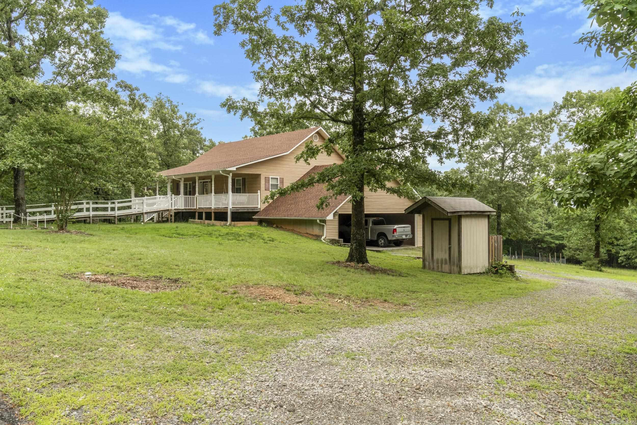 This is a nice home on 5.2 acres. Beautiful full view of Sugarloaf Mountain. 2 Bedrooms & 2 Baths on main level. Living room with fireplace. Laundry on Main floor. Eat in kitchen. Sunroom. Downstairs 2 Bedrooms, Bath, full kitchen and living area. Porches. Large Shop that is heated & cooled. Large fenced in garden spot. Covered area for your travel trailer, that you can just drive through. Don't miss out on this one.