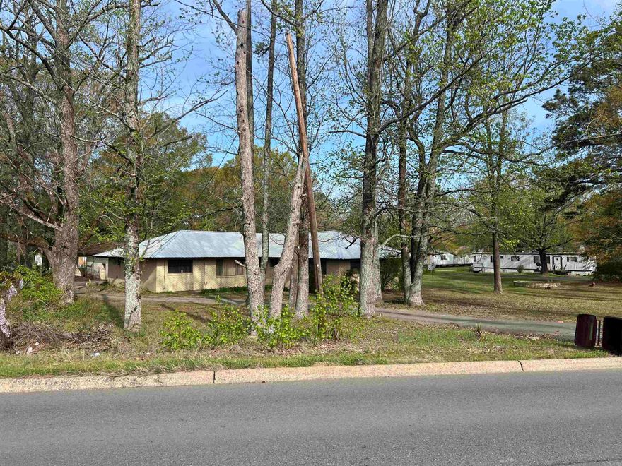 This charming five-bedroom, two-bath brick home sits on a spacious two-acre lot, offering plenty of room to enjoy the outdoors. Featuring large bedrooms and a small pantry, this property provides a solid foundation for a cozy and comfortable home. With a little love and care, it can be restored to its full potential, making it a fantastic investment opportunity. Don’t miss out on this hidden gem with endless possibilities!