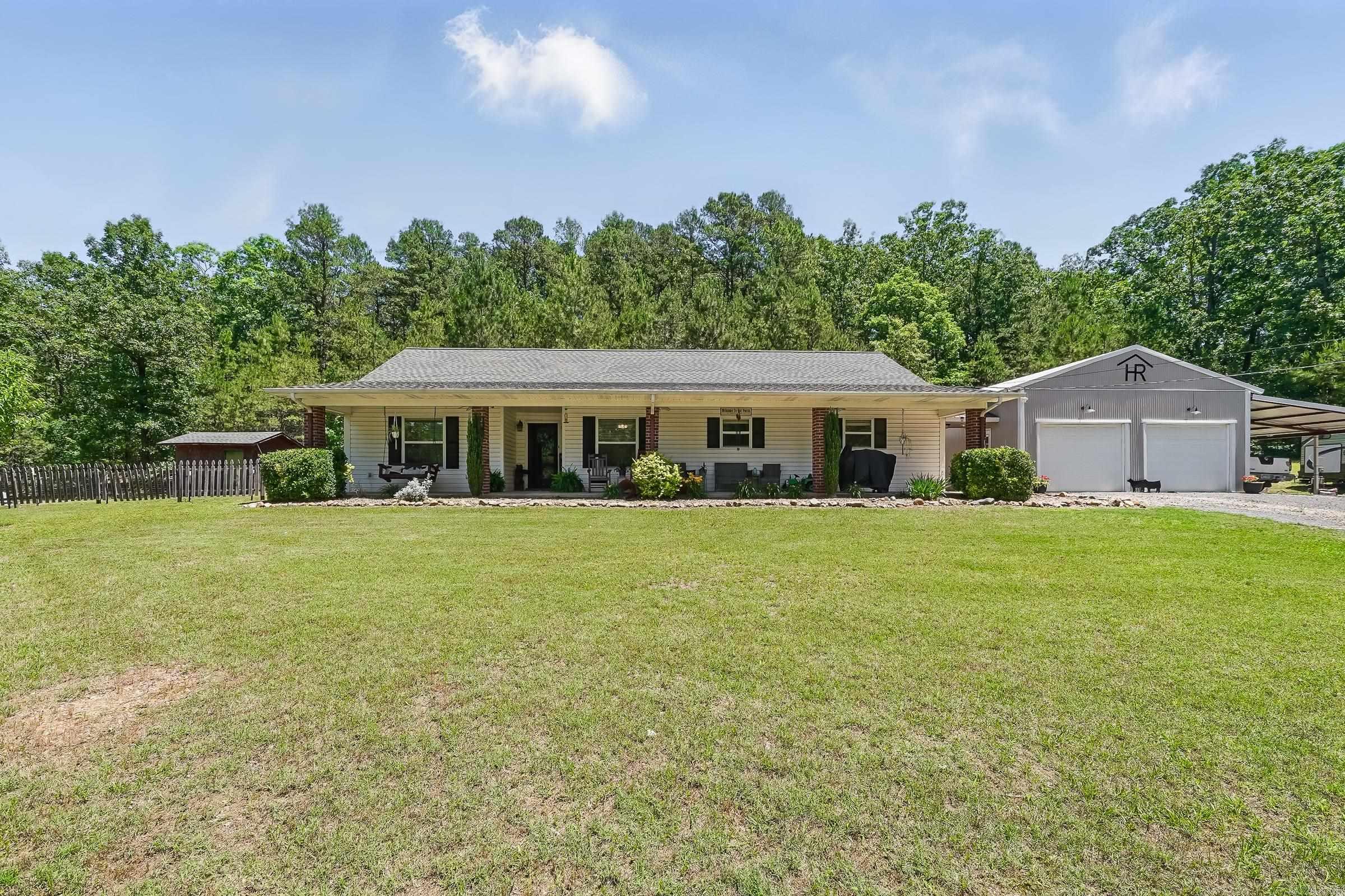 Snuggled amongst 20 acres of mostly hardwood this dream home is waiting for you! 2174 square feet of total comfort! 4 bedrooms, 2 1/2 bathrooms, and a laundry room. New flooring in all the bedrooms, the inside has been recently painted, the CHA unit is only 1 year old. The primary bedroom has it's own sitting area! Kitchen and bathrooms counter tops have been updated, check them out! All new kitchen appliances! Plus new fixtures. There is a 2-car garage/shop with a 2-car carport added, it was built only 4 years ago. Even a Chicken Coop is included! This lovely home is close to DeQueen lake, Sevier County Medical Center, and only 45 minutes from the famous Hochatown, OK.