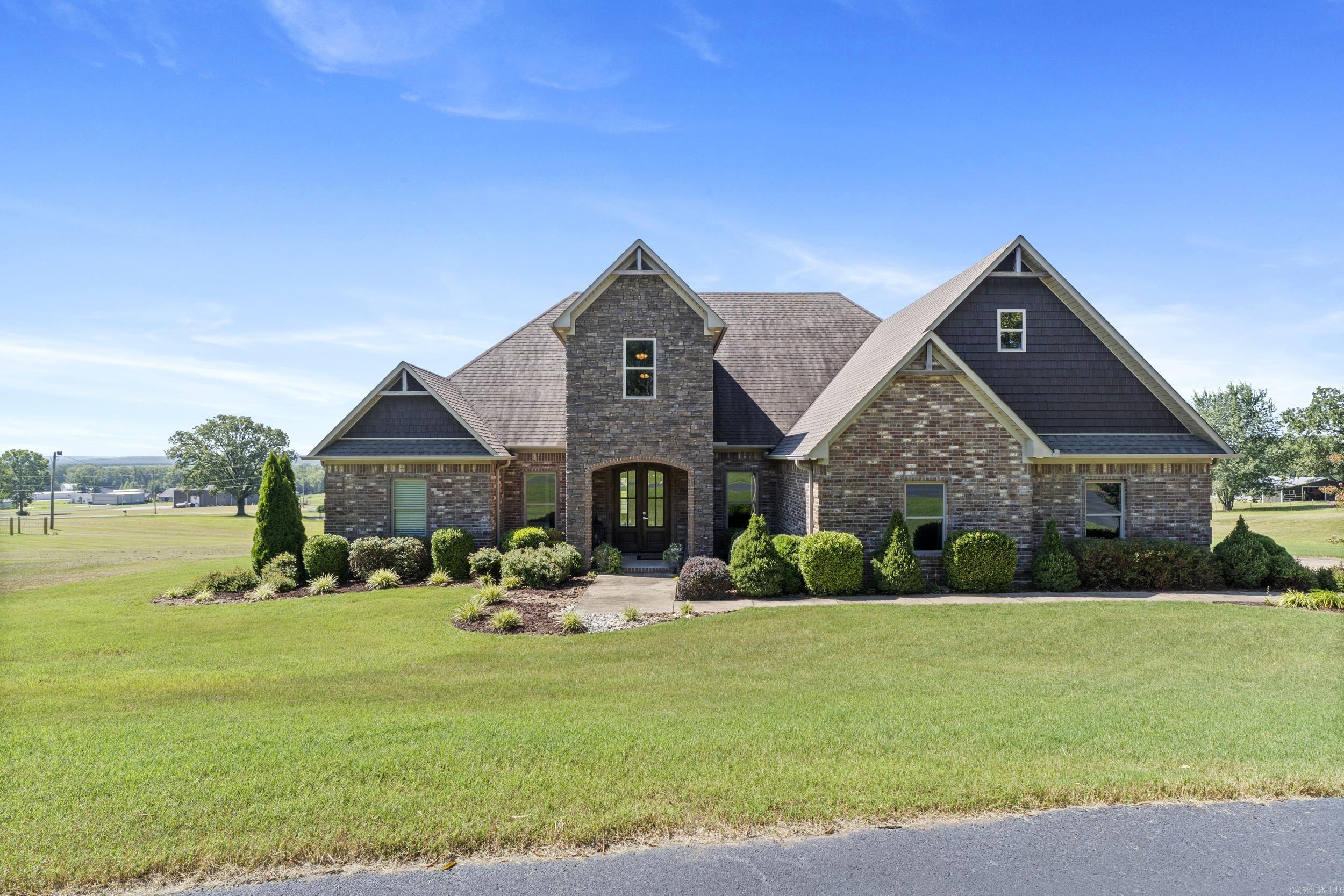 Welcome to ArkaValley Estates! Enjoy the stunning ridge view while relaxing on your large deck and deck swing that conveys with the property! This home's curb appeal is matched by its interior charm - from its warm finishes to the generous yard with partial iron fencing, perfect for outdoor living, entertaining, or simply enjoying the natural setting. This beautiful 4-bedroom, 3-bath home sits on 2.8 acres in the highly sought-after Greenbrier School District. Thoughtfully designed with space and comfort in mind, the 4th bedroom features a large multi-pupose bonus area perfect for a playroom or home office. Only 8 minutes from I-40, don't miss this rare find in one of Springhill's most desirable areas!