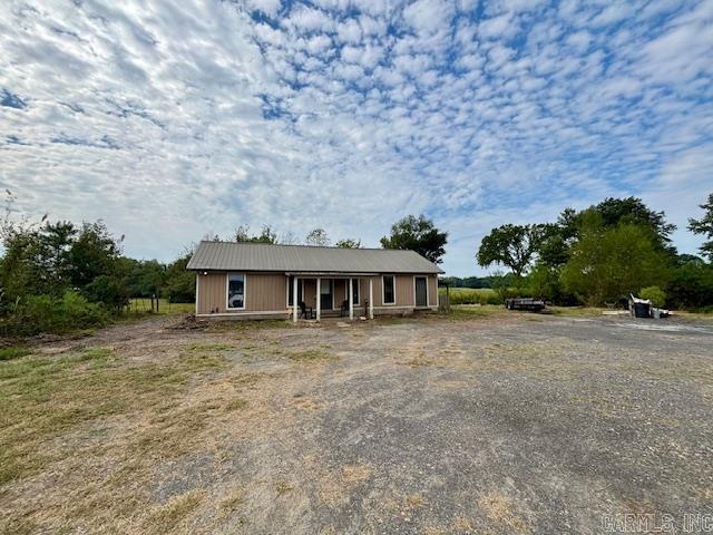 This charming 3 bed, 1 bath home is full of character with concrete floors, wood and metal accents throughout. The cozy family room opens to the kitchen, creating a warm and inviting space. There is also an extra space that could be a great office. Sitting on 1.24 acres that once operated as a nursery, this property offers endless possibilities—perfect for gardening, hobby farming, or simply enjoying the outdoors. A little country charm with plenty of room to grow!