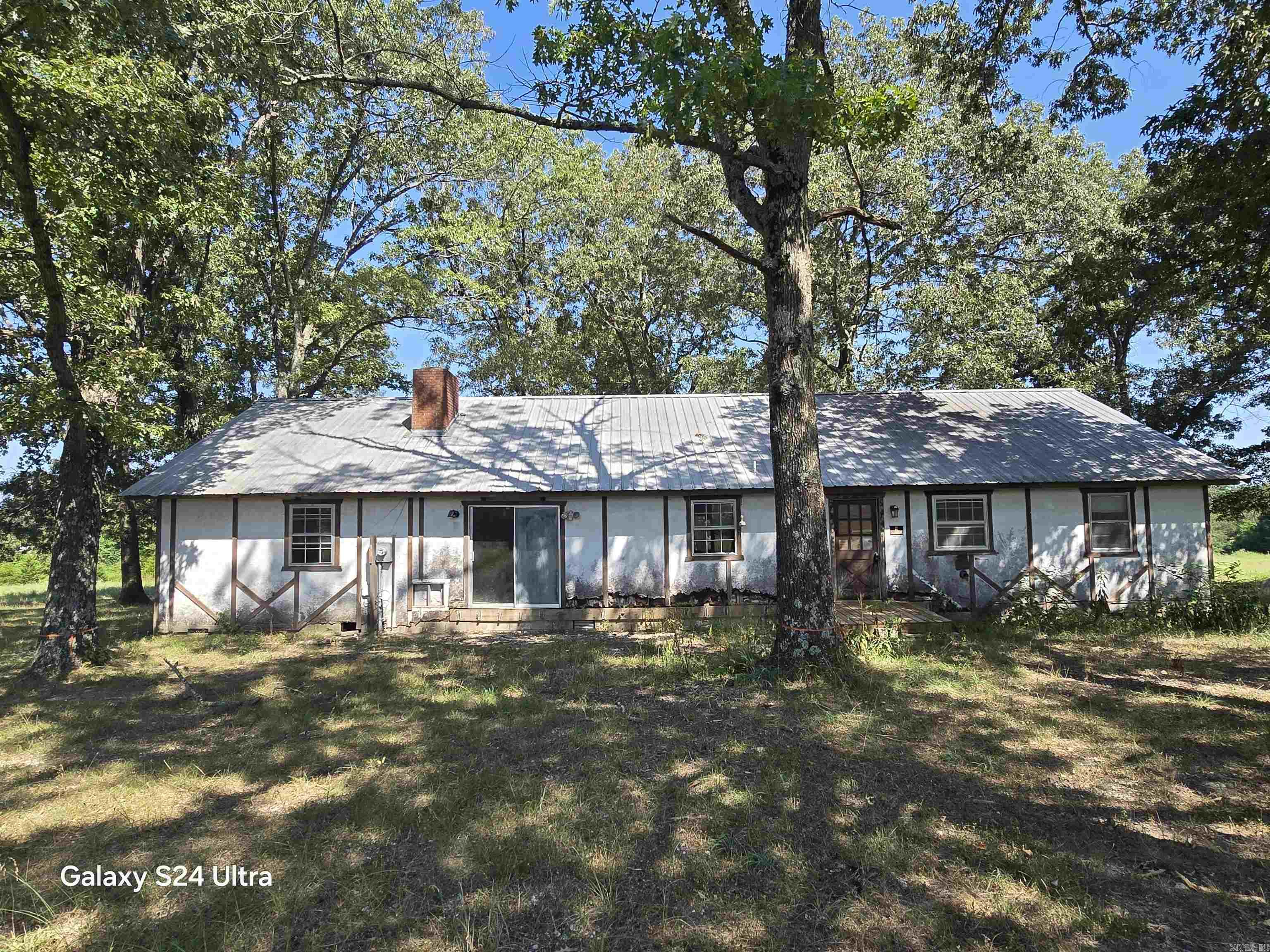 Welcome back to the market this spacious, one level, 4 bed 2 Bath home with over 2200 sq ft of endless possibilities and potential! Sitting on 1+/- Acre in beautiful Mountain View, Arkansas known for being the Folk Music Capital of the World! This charming home sits in the Hopper Meadows Subdivision and does have some restrictions to protect its surroundings and beauty! Just minutes from the White River, the Ozark Folk Center State Park, and Blanchard Springs Caverns makes this location even more ideal for the nature and fun-lover. This home is also only a few minutes to downtown Mountain View and the Courthouse square where music and entertainment abound especially on the weekends. With some love and renovations this home could be restored to its original beauty or skillfully updated to modern times. Ample space, a prime location, and the chance to create your dream or rental property are just a few reasons why you should see this home in one of the Ozarks' most desirable areas! Don't miss out on the opportunity to see it for yourself. This home is priced to sell and is being offered at it's low price AS IS. Schedule your showing before it's gone!