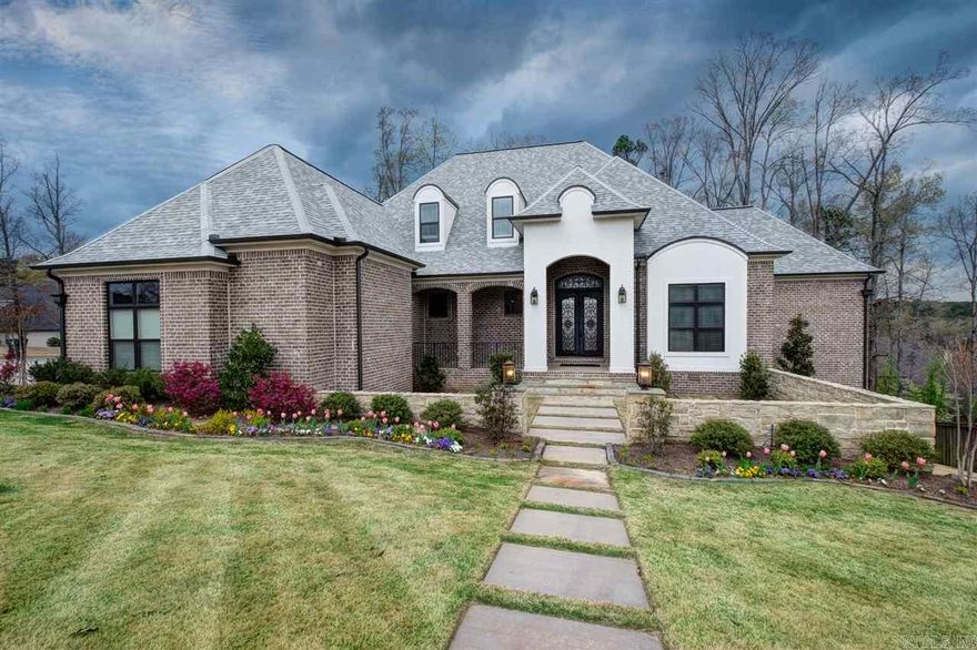 Custom showcase built by Martin Signature homes. Unsurpassed detail quality & design. Hickory wood floors, open living & high ceilings exposed beams. Linear FP, granite wall & barrel entry ceiling. Chef's kitchen- copper farm sink, granite island, & gas cooktop. Large mud room, utility & laundry. 5 En suite bathrooms. Large master suite w/sitting area. Versatile floor plan w/game room option upstairs. Distressed ceilings, custom iron railing. Cozy screen porch w/button off screens. Stone enclosed courtyard.