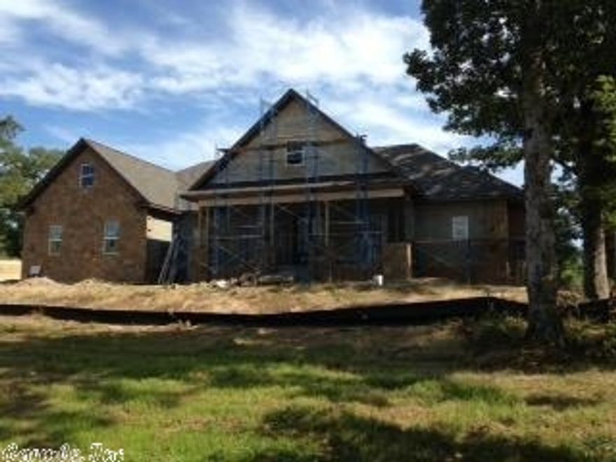 Arkota Shores II is now under construction.  Gated community with rolling hills and large trees,  some lots will have views of Lake Hamilton. Pre-construction pricing on craftsman inspired home with open floor plan. Kitchen with lots of storage, open to the great room with a floor to ceiling rock fireplace.  Front porch and back covered deck.  All bedrooms on the main , bonus above garage. Owner agent. Homeowners will have access to family park on Lake Hamilton, lake access for kayak or canoe.