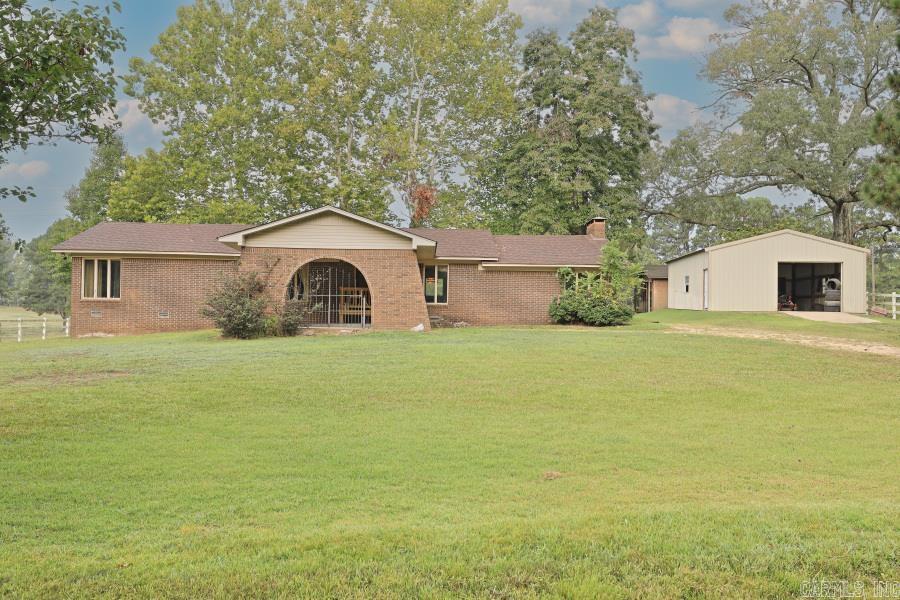 Surrounded by beautiful serene farmland, this 4 BR 2 BA home has the most beautiful view. Quiet and country, there's room enough for the entire family. It was custom built with love originally, and now it's waiting for you to start YOUR family's story here. Gorgeous drop-down den with vaulted ceiling is impressive! "Great bones" is the saying, and it's ready for you to transform it into your family's country home! 24 x 30 insulated shop is perfect for all of your projects, and the additional 18 x 14 shed provides even more space for hobbies. Lots of space for the money