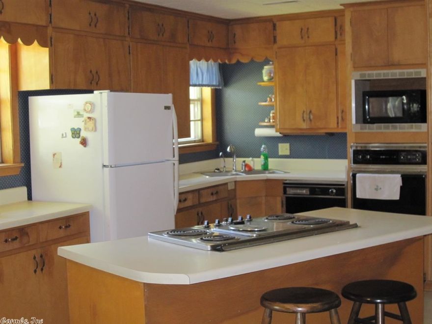 Well-maintained home located on nice tree shaded lot. Large kitchen/dining area with pantry and down-draft electric stove. Spacious living room with hardwood floors underneath carpet. Guest bedroom with built-in desk, master bath has separate shower and Jacuzzi tub. New roof. Priced to sell, call today for your personal tour.