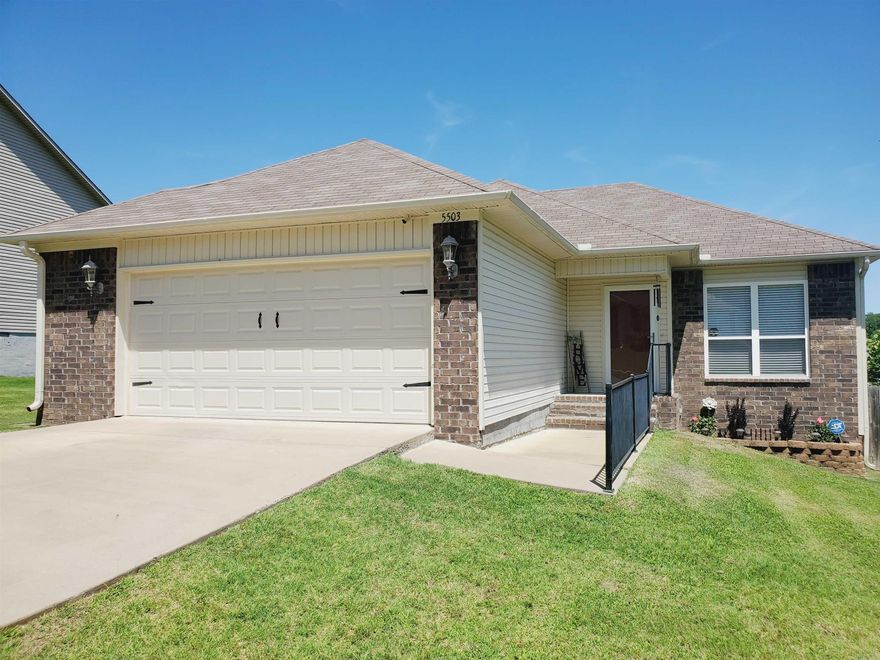 Adorable & Cozy open floor plan in desirable Greenwood Acres neighborhood conveniently located & minutes from Interstate, downtown LR, hospitals and many amenities. Fully fenced oversized backyard w/ double gate for recreational vehicle & detached concrete gated area for your pet. Newer LVP flooring in great room & hall & recently added modern stone fireplace with remote will keep everyone warm on chilly nights. Nice custom bar with granite countertop near dining area & bay window opens up to your kitchen & leads to quaint wood deck. Nice size bedrooms & an oversized primary suite in this well-maintained home has plenty of curb appeal. Huge garage has an extra space for tools or appliances  & truly makes this home perfect for the new homeowner. French drain & encapsulation installed for extra precaution! Refrigerator, alarm & cameras may convey. Inspected, appraised and waiting on you. Welcome home!